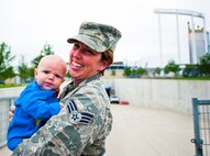 Volunteers of all ages  from Whiteman Air Force Base participated in the 9/11 memorial flag ceremony at the Kansas City Royals baseball game on Sept. 11, 2014. Airmen participated from the 442 Fighter Wing, 509 Bomb Wing and other units across the base. (Photo by Tech. Sgt. Emily F. Alley, 442FW public affairs)