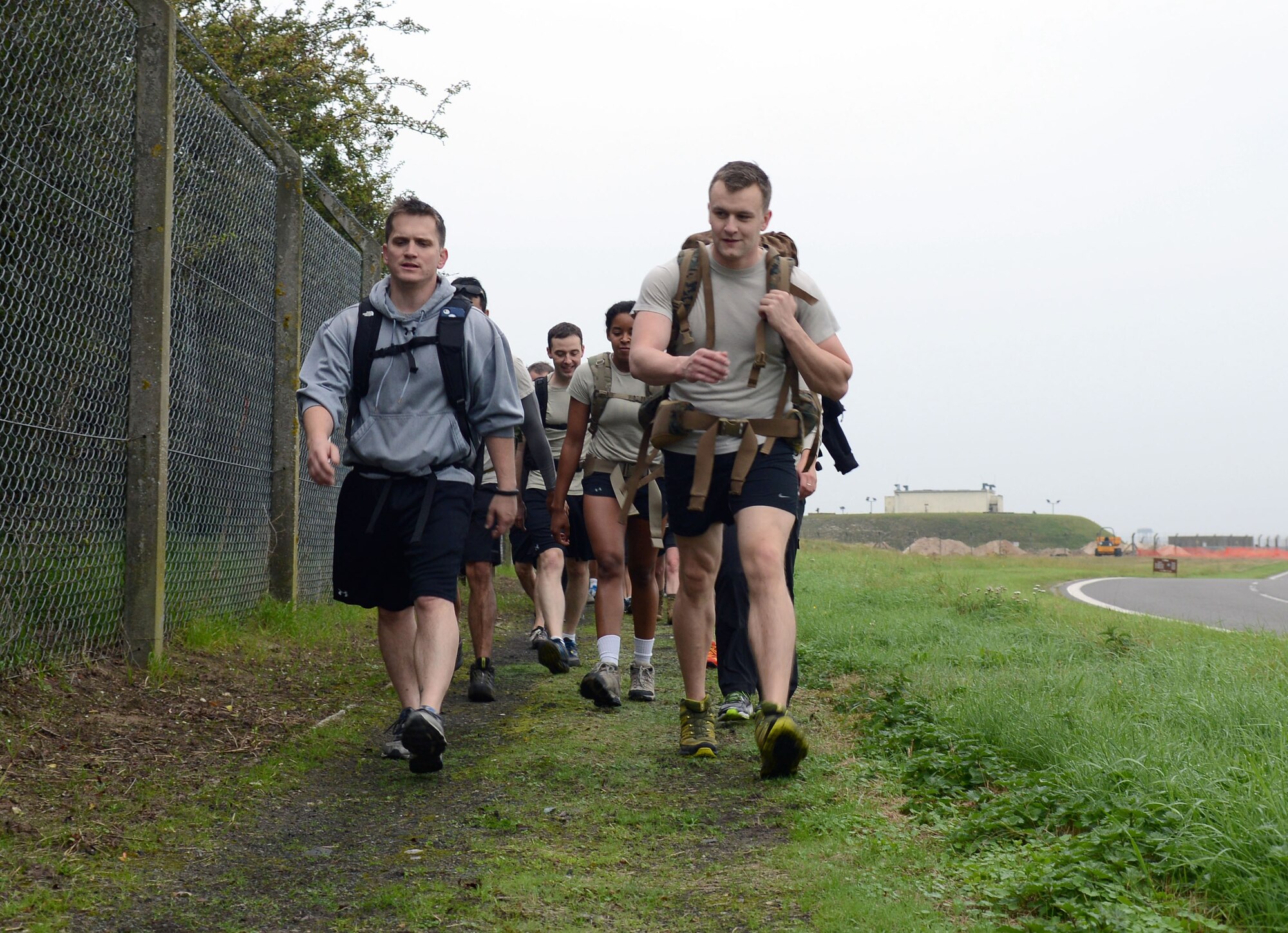 Airmen from the 352nd Special Operations Group participate in a 9/11 Memorial Ruck Sept. 11, 2014, on RAF Mildenhall, England. In honor of the fallen men and women, the 352nd SOG held a 10K ruck march along the base perimeter and finished the event with push-ups. (U.S. Air Force photo/Airman 1st Class Kyla Gifford/Released)
