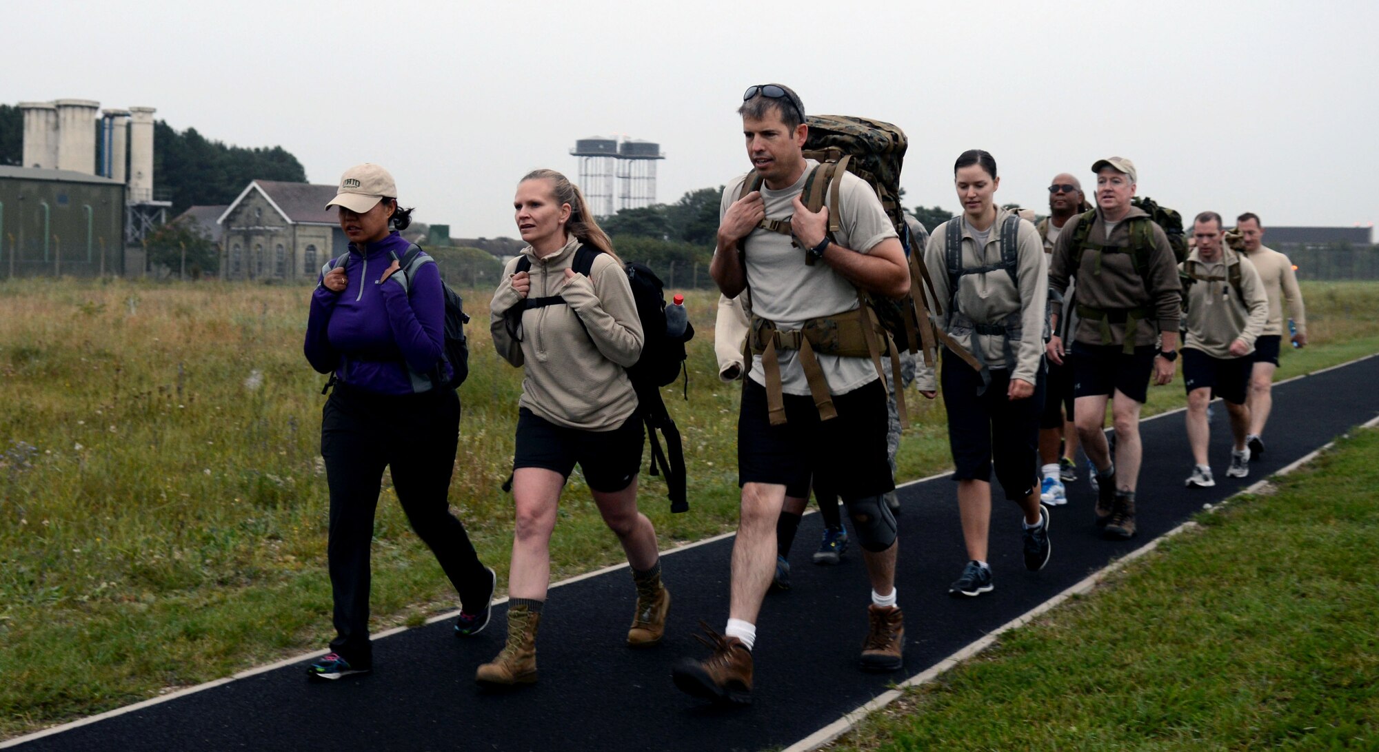 Airmen from the 352nd Special Operations Group participate in a 9/11 Memorial Ruck Sept. 11, 2014, on RAF Mildenhall, England. The participants carried 13 percent of their bodyweight along the base perimeter in honor of the 13 year anniversary of the attacks on Sept. 11, 2001. (U.S. Air Force photo/Airman 1st Class Kyla Gifford/Released)