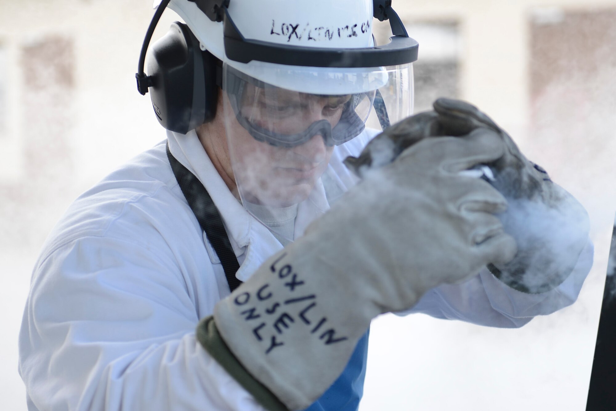 Senior Airman Jeffery Halda, 86th Logistics Readiness Squadron hydrants technician, samples liquid oxygen for cleanliness on Ramstein Air Base, Germany, Sept. 3, 2014. Liquid oxygen is primarily used as breathing oxygen for aircrew members while flying over 10,000 ft. (U.S. Air Force photo/Airman 1st Class Michael Stuart)