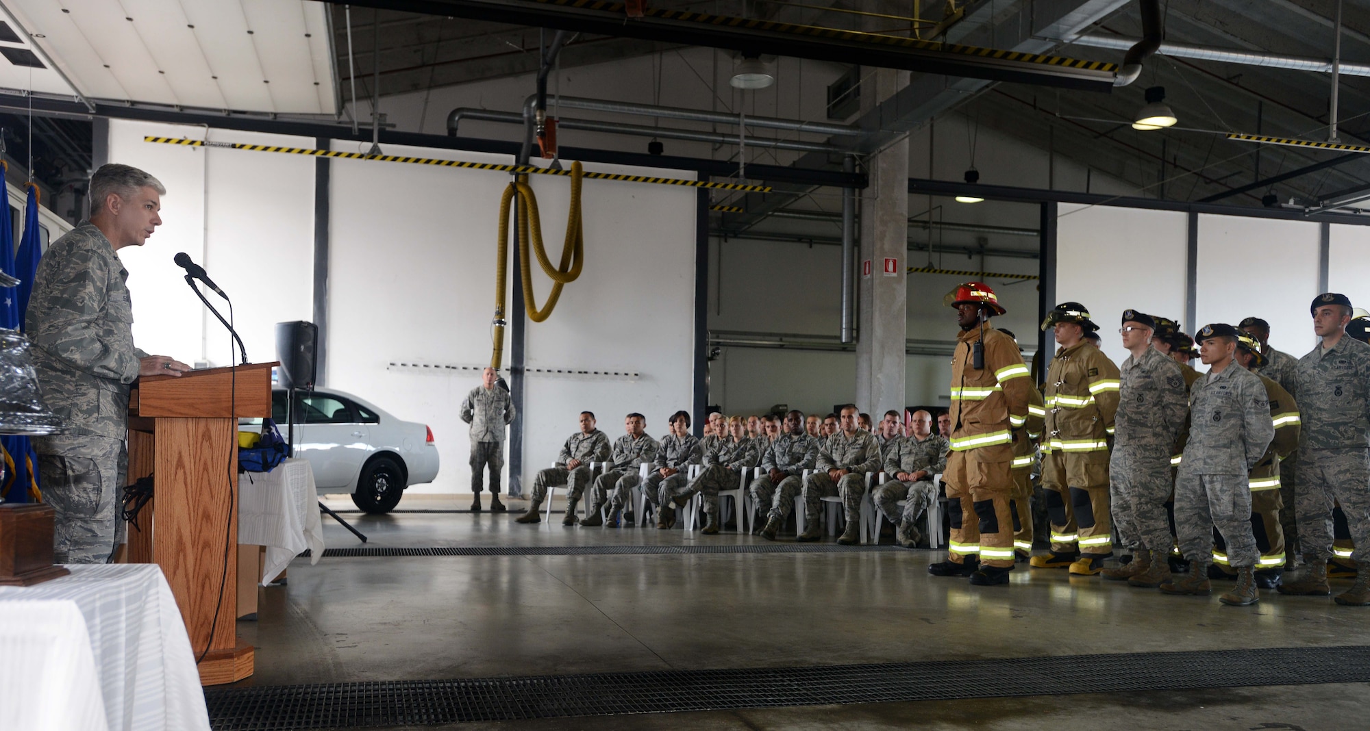 Brig. Gen. Barre Seguin, 31st Fighter Wing commander, gives opening comments during a 9/11 remembrance ceremony, Sept. 11, 2014, at Aviano Air Base, Italy. More than 200 Aviano members attended the ceremony to remember the events that took place 13 years ago. (U.S. Air Force photo/Airman 1st Class Deana Heitzman)