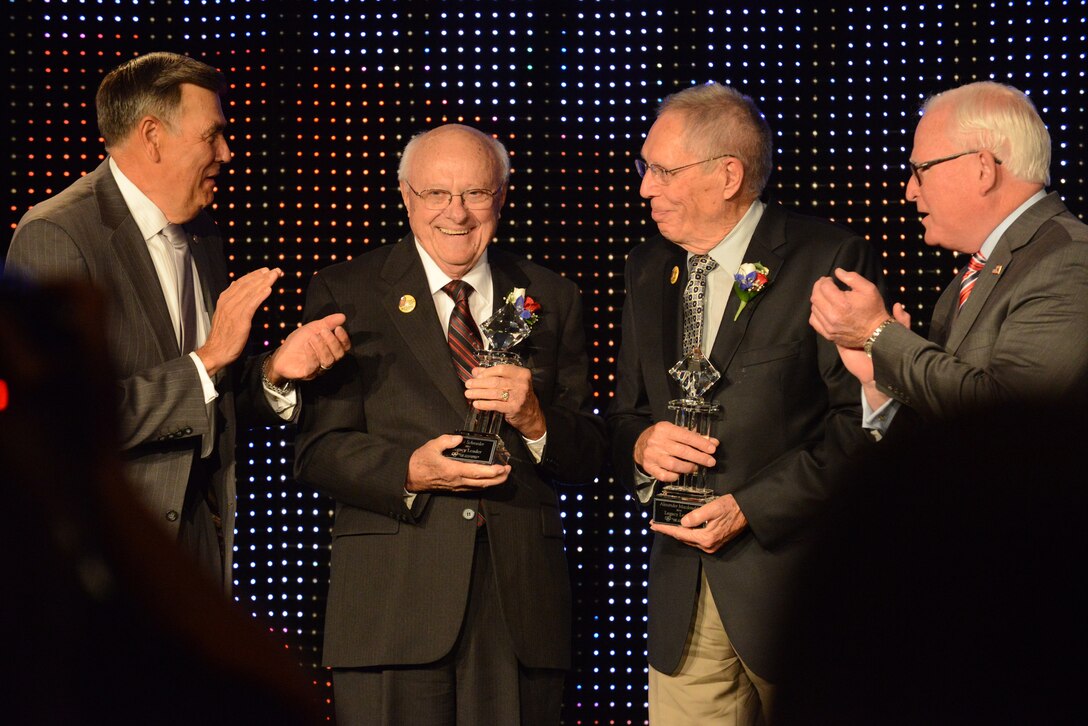 Retired Maj. Gen. Mike Haugen, former North Dakota Adjutant General, far left, and Fargo Moorhead West Fargo Chamber of Commerce President Craig Whitney, far right, present the Legacy Leader Award to retired Maj. Gen. Alexander Macdonald, another former North Dakota Adjutant General, second from right, and retired Maj. Gen. Darrol Schroeder, former Chief of Staff of the North Dakota Air National Guard, during the chamber organization’s annual meeting at the Holiday Inn in Fargo, North Dakota, Sep. 11, 2014. The Legacy Leader Award recognizes the important role and contributions of longtime local leaders in both shaping and serving The Chamber, the Fargo, Moorhead and West Fargo metropolitan community region. (U.S. Air National Guard photo by Senior Master Sgt. David H. Lipp/Released)