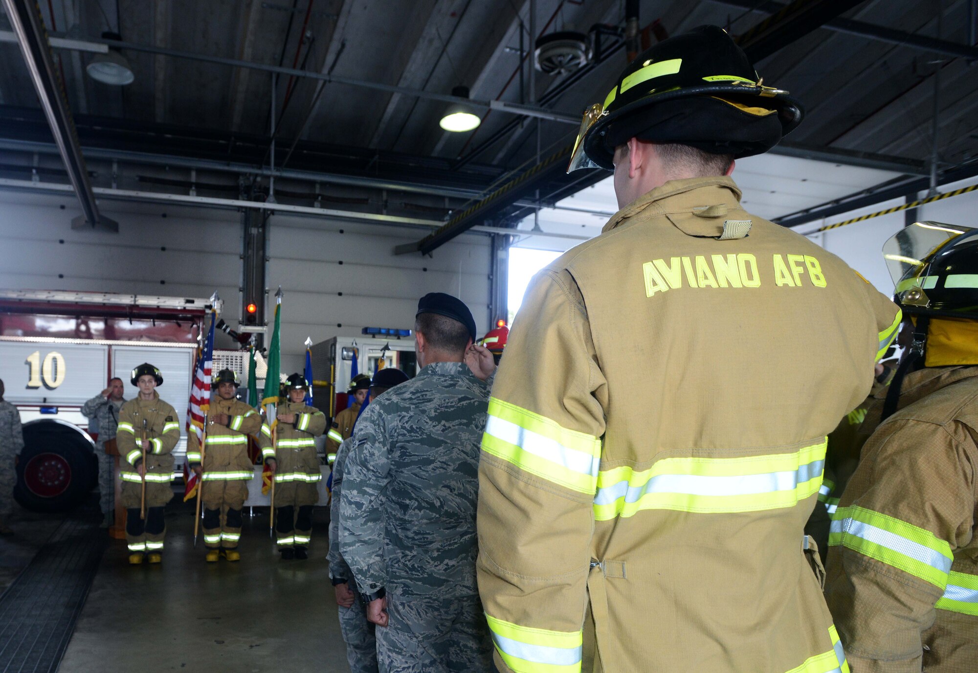 Aviano first responders stand in formation during a 9/11 remembrance ceremony, Sept. 11, 2014, at Aviano Air Base, Italy. More than 200 Team Aviano members attended the ceremony to remember the events that took place 13 years ago. (U.S. Air Force photo/Airman 1st Class Deana Heitzman)
