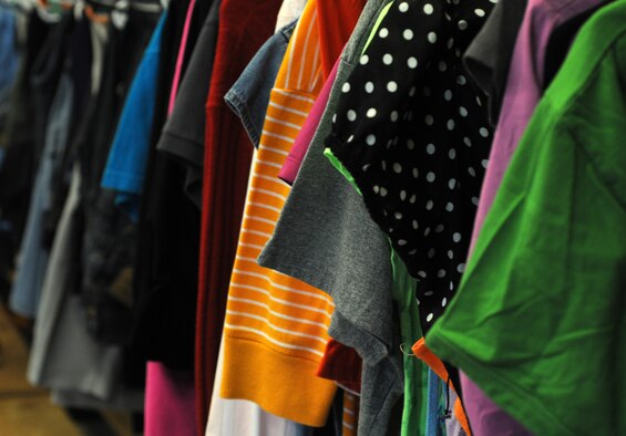 Donated clothes are displayed on a clothes rack Sept. 10, 2014, in the community closet on RAF Mildenhall, England. The community closet is open Mondays, Wednesdays and Fridays from 10 a.m. to 2 p.m. and can be reached at DSN 238-4606 and commercial at 01638 544606. (U.S. Air Force photo/Gina Randall/Released)