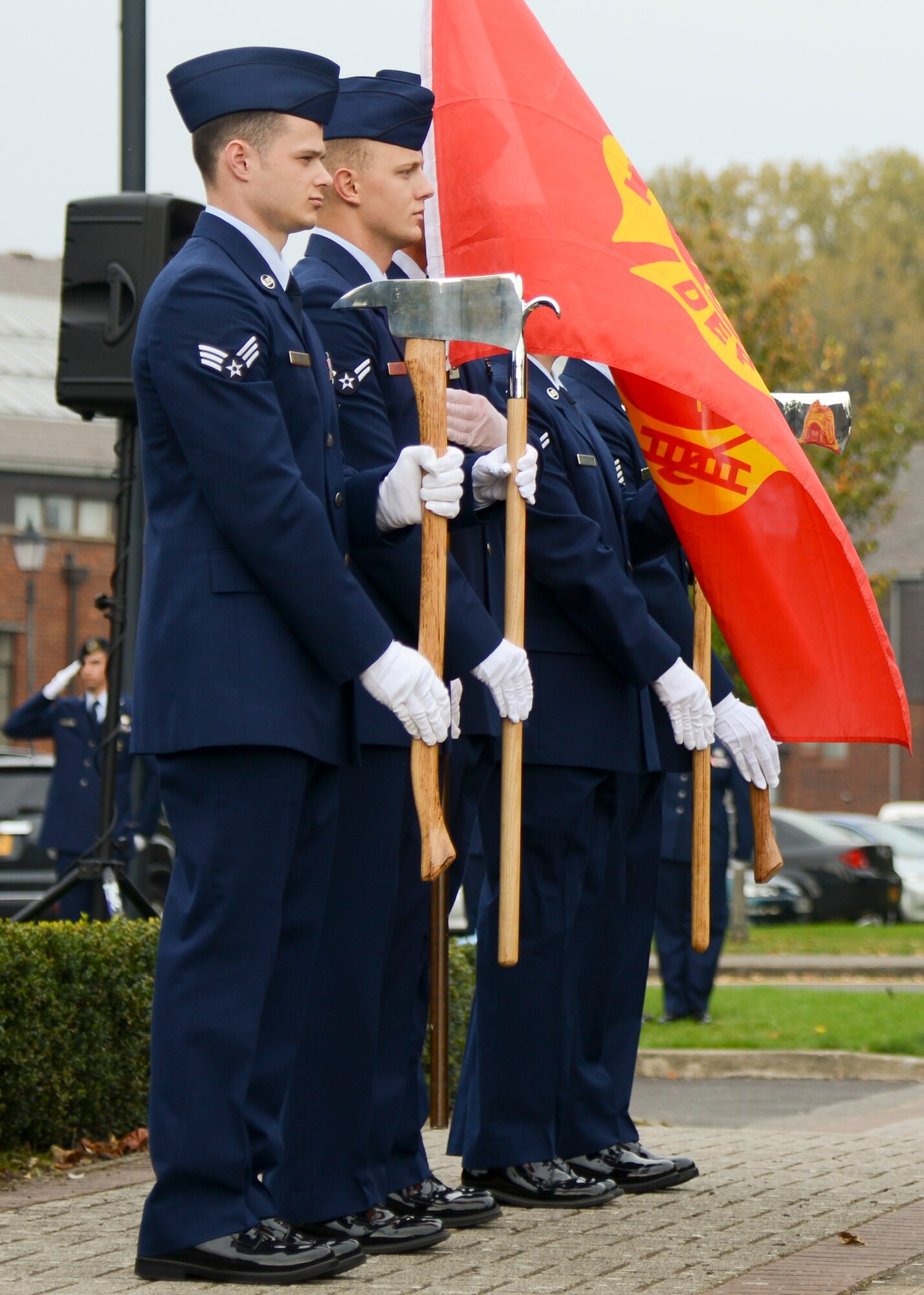 Firefighters from the 100th Civil Engineer Squadron and the 48th CES Fire Departments participate in a 9/11 memorial retreat ceremony Sept. 11, 2014, on RAF Mildenhall, England. This year marked the 13th anniversary of the attacks on the World Trade Center in New York City. (U.S. Air Force photo/Senior Airman Victoria H. Taylor/Released)