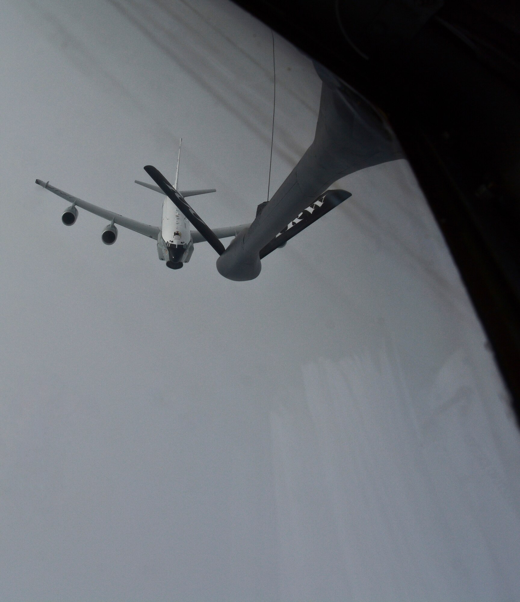 A U.S. Air Force RC-135U Combat Sent flies behind a KC-135 Stratotanker assigned to RAF Mildenhall, England, Sept. 10, 2014, after refueling over Norway. All RC-135U aircraft are equipped with an aerial refueling system, giving it an unlimited flying range. (U.S. Air Force photo/Senior Airman Micaiah Anthony/Released)