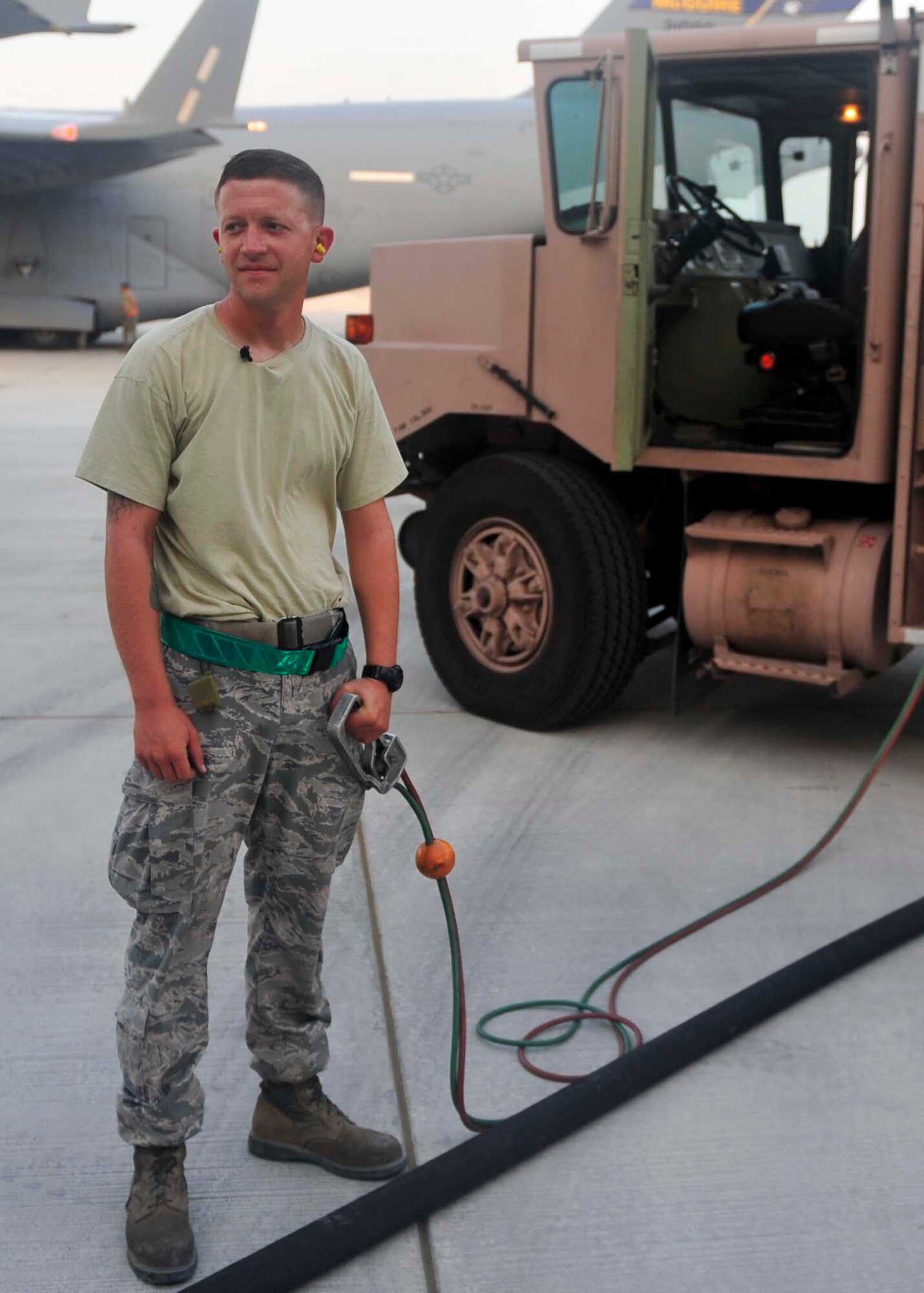 U.S. Air Force Staff Sgt. Alvin Burton, 379th Expeditionary Logistics Readiness Squadron fuels distribution operator, pumps the record breaking three billionth gallon of fuel into a fueling a C-17 Globemaster III at Al Udeid Air Base, Qatar, Sept. 9, 2014. The 379th ELRS fuels distribution operators pump nearly 850,000 gallons of JP-8 in a day, making it the busiest fuels hub in the Department of Defense. (U.S. Air Force photo by Senior Airman Colin Cates)