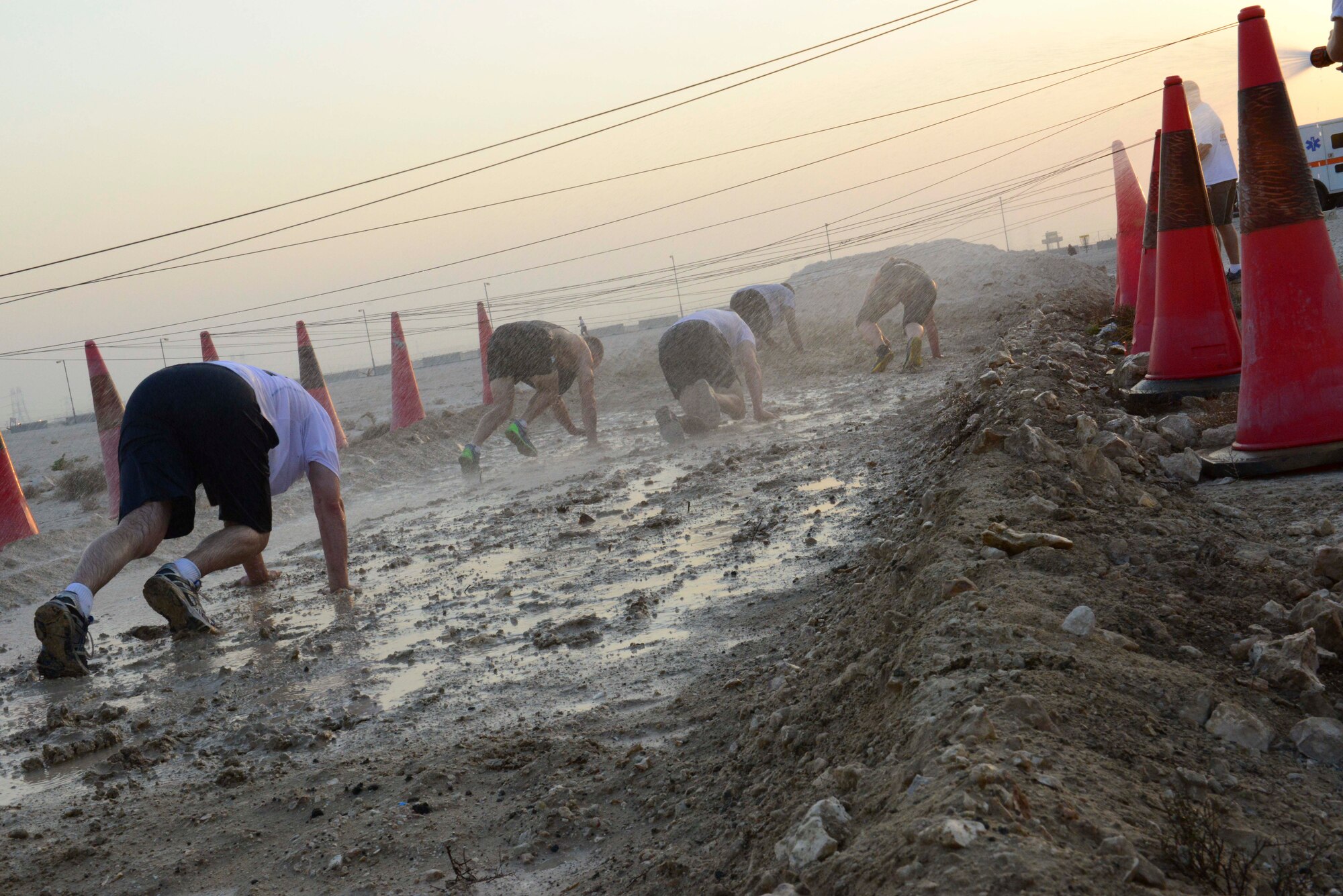 Service members complete a Combined Federal Campaign event at Al Udeid Air Base, Qatar, Sept. 8, 2014. The CFC is the only approved charity drive for federal employees and offers thousands of charities from which to choose. (U.S. Air Force photo by Staff Sgt. Ciara Wymbs)