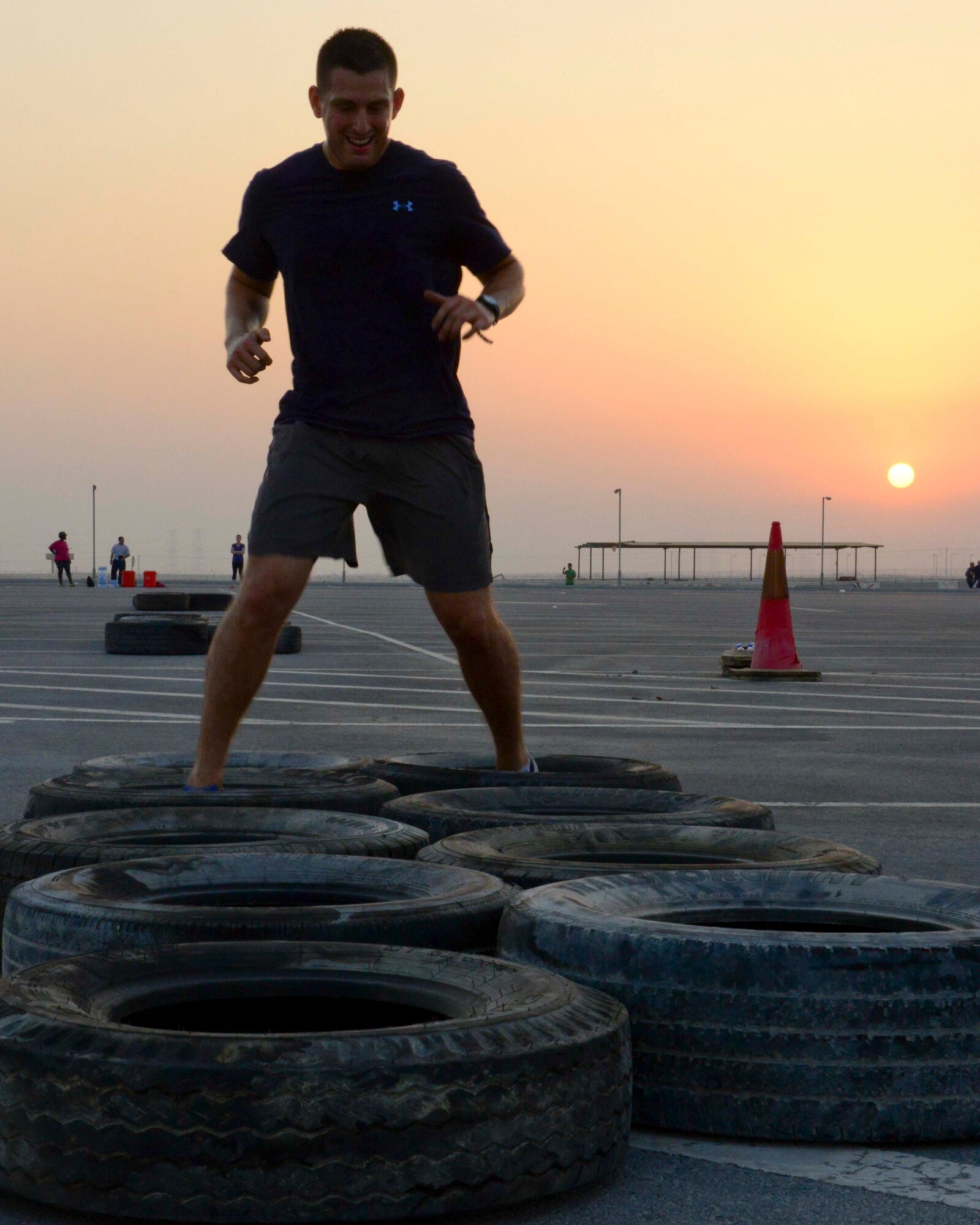 A Service member completes an obstacle as part of a Combined Federal Campaign event at Al Udeid Air Base, Qatar, Sept. 8, 2014. The campaign, which lasts now through November 7, is the only approved charity drive for federal employees. (U.S. Air Force photo by Staff Sgt. Ciara Wymbs)
