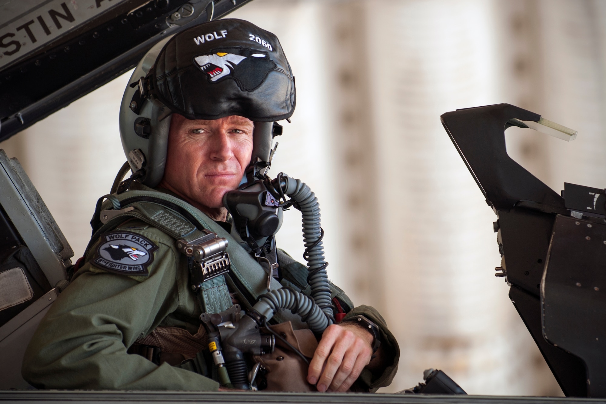 Col. Ken “Wolf” Ekman, 8th Fighter Wing commander, prepares for his flight in an F-16 Fighting Falcon at Kunsan Air Base, Republic of Korea, Sept. 10, 2014. The F-16 is being flown to Osan AB to temporarily operate flying missions while the runway at Kunsan is under construction for repairs. (U.S. Air Force photo by Senior Airman Taylor Curry/Released)
