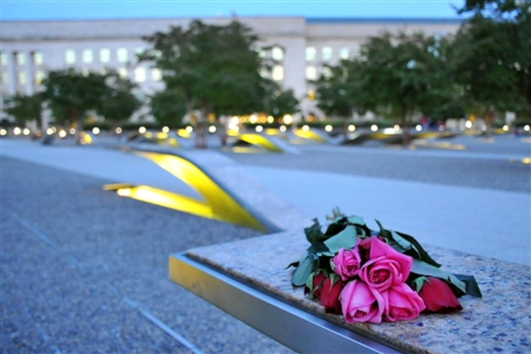 Lights illuminate the National 9/11 Pentagon Memorial as the sun sets at the Pentagon, Sept. 10, 2014. The memorial was created to remember and honor those lost during the 9/11 terrorist attacks. 