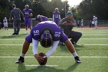 Jaycee D. Pummill, the Blue Springs High School senior long snapper and a 2015 Semper Fidelis All-American Bowl selectee, prepares to snap the ball to his position coach, Nolan Hochgrebe, during warmups before the Wildcats game against the St. Joseph Central High School Indians at Peve Stadium Sept. 12, 2014. Pummill is one of approximately 100 players selected from across the nation to participate in the Semper Fi Bowl next year at the StubHub Center in Carson, Calif.,  on Jan. 4, 2015, and will be aired live on Fox Sports 1 at 6 p.m. Pacific Standard Time.