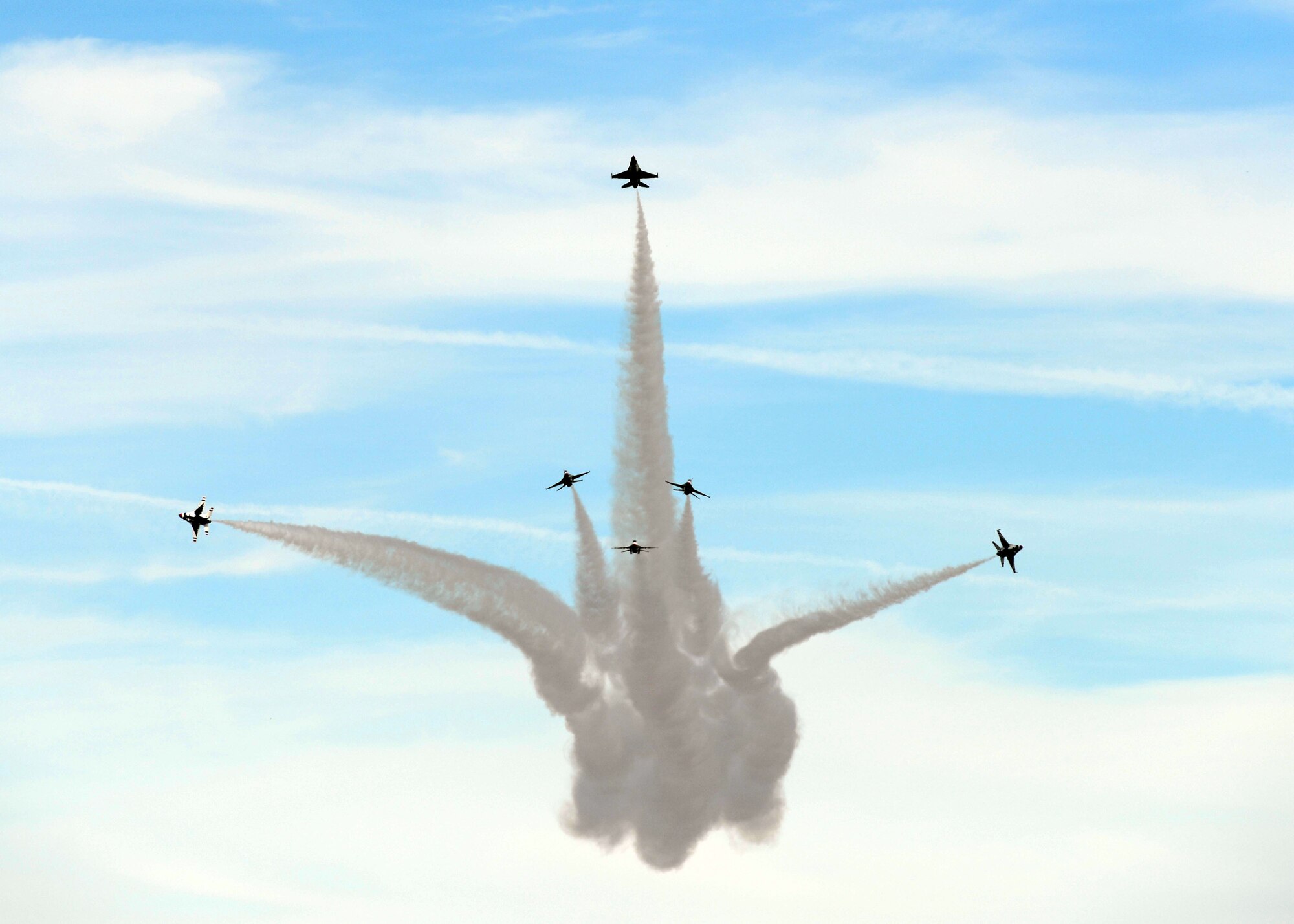 ALTUS AIR FORCE BASE, Okla. – The U.S. Air Force Thunderbirds perform a delta burst during the 2014 Wings of Freedom Open House, Sept. 13, 2014. The U.S. Air Force Air Demonstration Squadron, better known as the Thunderbirds, performs precision aerial maneuvers demonstrating the capabilities of Air Force high performance aircraft to people throughout the world. The squadron exhibits the professional qualities the Air Force develops in the people who fly, maintain and support these aircraft. This is the first time Altus AFB has opened its gates to the public since 2012. (U.S. Air Force photo by Senior Airman Levin Boland/Released) 