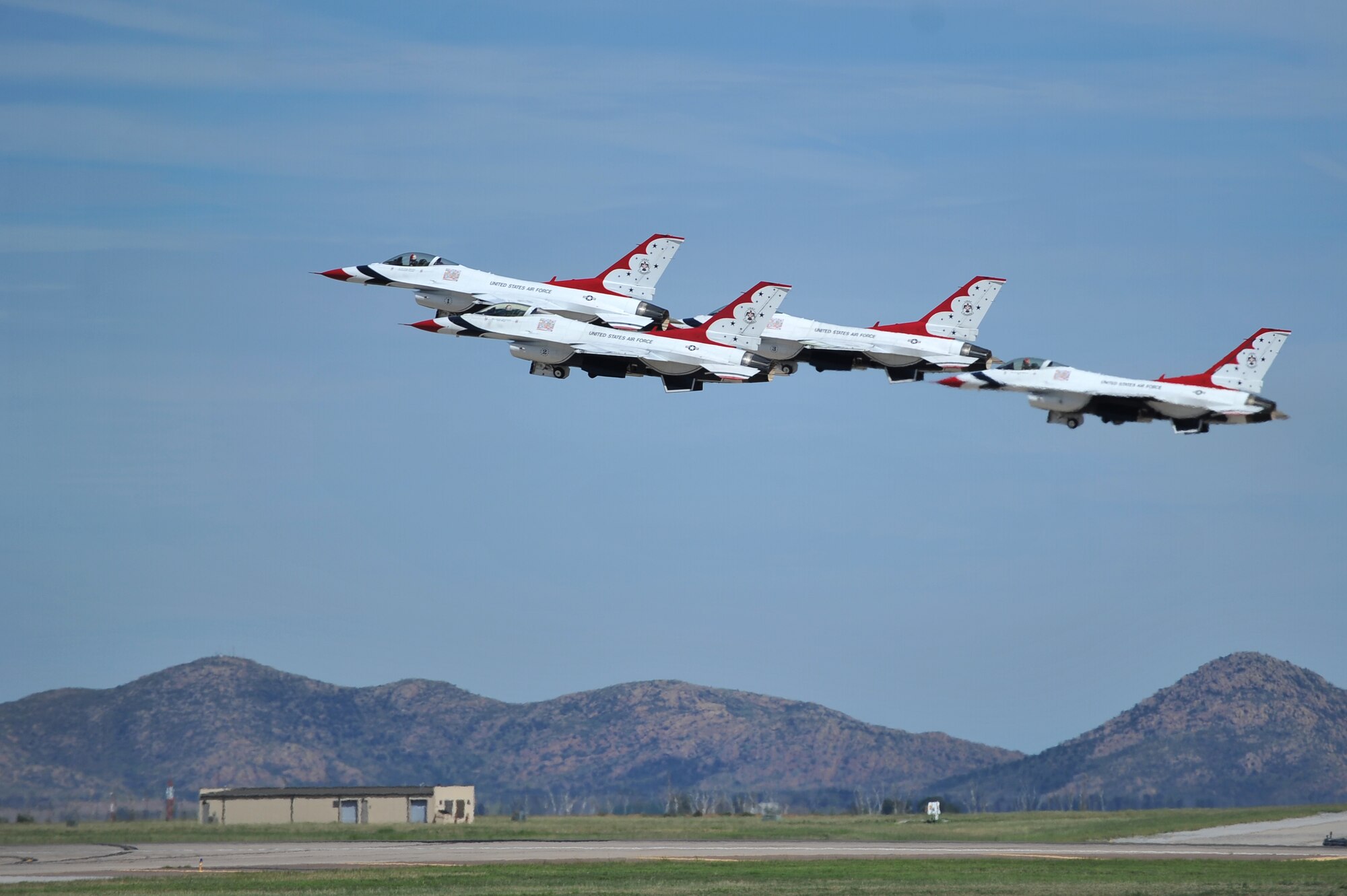 ALTUS AIR FORCE BASE, Okla. – Members of the U.S. Air Force Thunderbirds take off during the 2014 Wings of Freedom Open House, Sept. 13, 2014. The U.S. Air Force Air Demonstration Squadron, better known as the Thunderbirds, performs precision aerial maneuvers demonstrating the capabilities of Air Force high performance aircraft to people throughout the world. The squadron exhibits the professional qualities the Air Force develops in the people who fly, maintain and support these aircraft. (U.S. Air Force photo by Senior Airman Dillon Davis/Released)