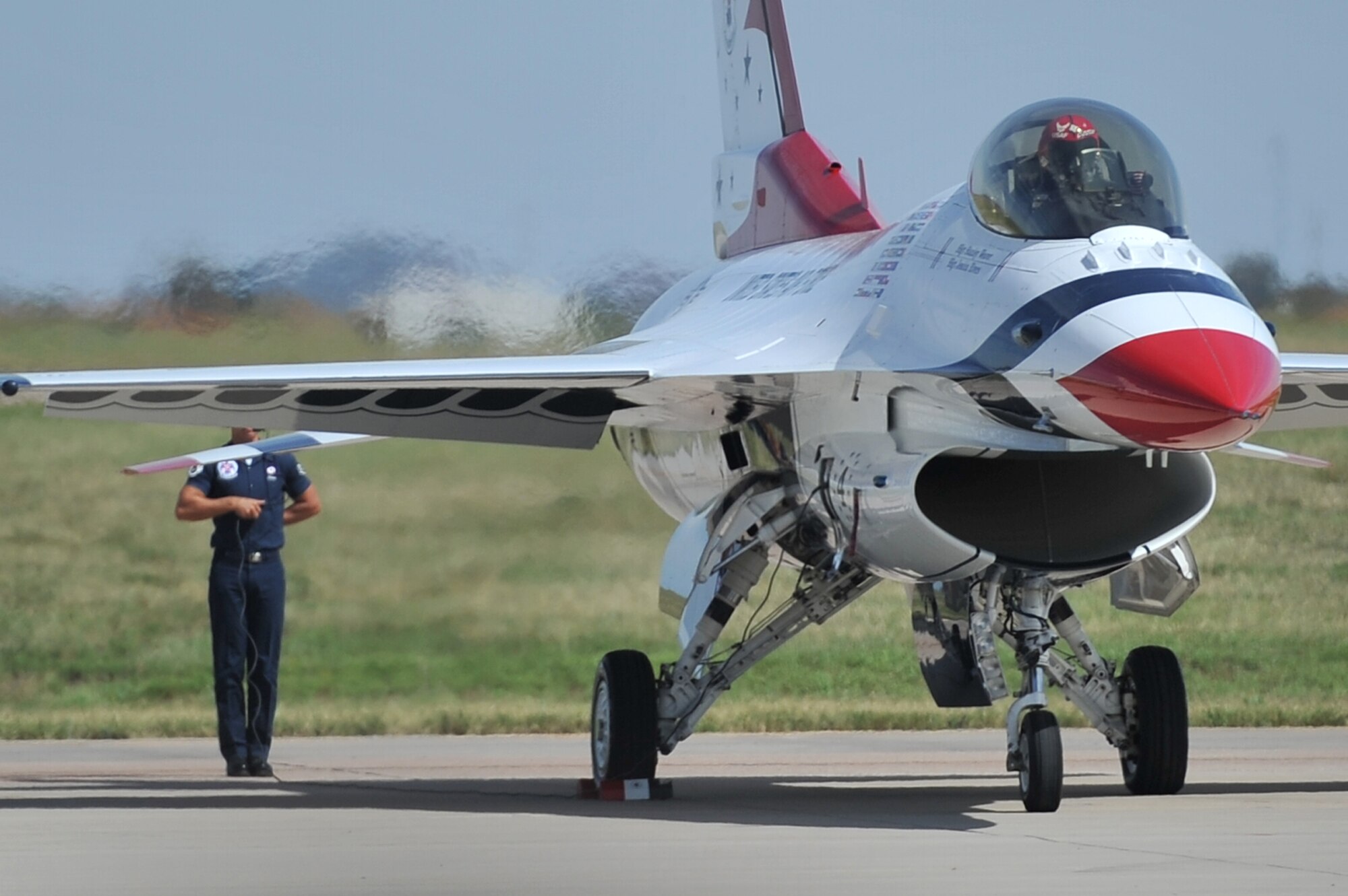 ALTUS AIR FORCE BASE, Okla. – A member of the U.S. Air Force Thunderbirds prepares for flight during the 2014 Wings of Freedom Open House, Sept. 13, 2014. The Thunderbirds are an important recruiting tool for the Air Force because they demonstrate the professional competence of Air Force members to the public. (U.S. Air Force photo by Senior Airman Dillon Davis/Released)