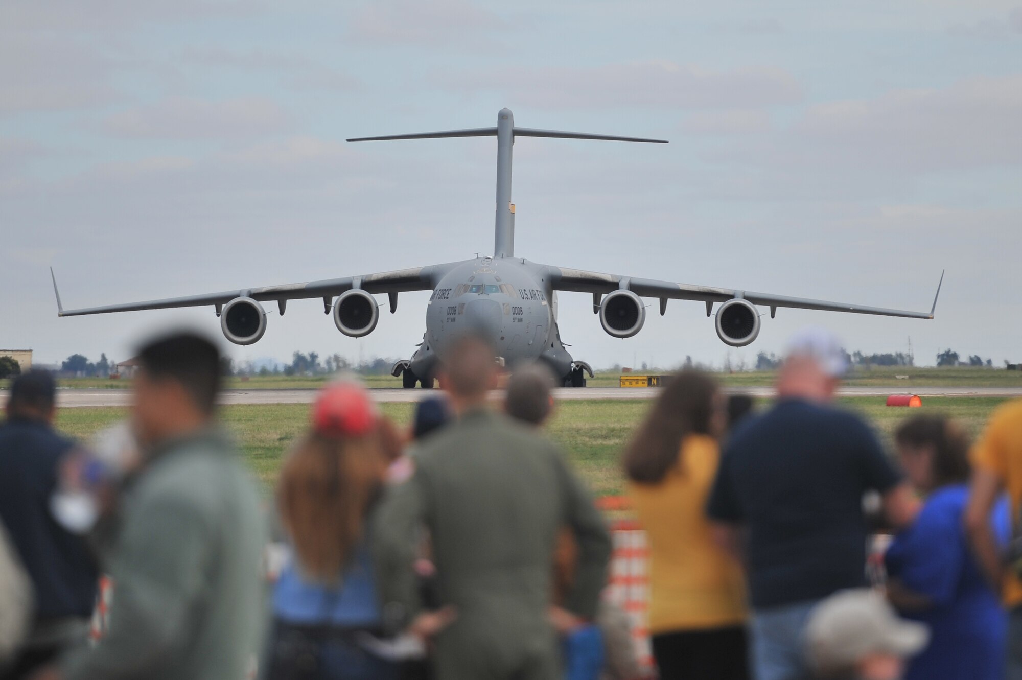 ALTUS AIR FORCE BASE, Okla. – Visitors watch as a U.S. C-17 Globemaster III from Altus Air Force Base taxis back to the aircraft ramp during the 2014 Wings of Freedom Open House, Sept. 13, 2014. The C-17 is assigned to the 58th Airlift Squadron and performed a live aerial refueling demonstration for spectators at this year’s open house. (U.S. Air Force photo by Senior Airman Dillon Davis/Released)