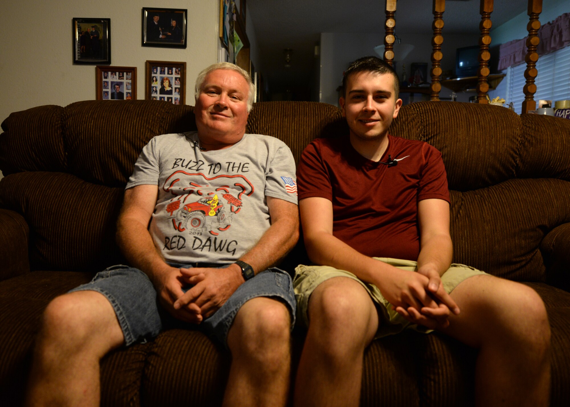 ALTUS, Okla. – Thomas Farley and his Father, Clensey, sit together on a couch at their home in Altus, Okla., Sept. 10, 2014. Thomas is being sworn into the U.S. Air Force by Thunderbird pilots during the 2014 Wings of Freedom Open House on Altus Air Force Base. (U.S. Air Force photo by Senior Airman Levin Boland/Released)
