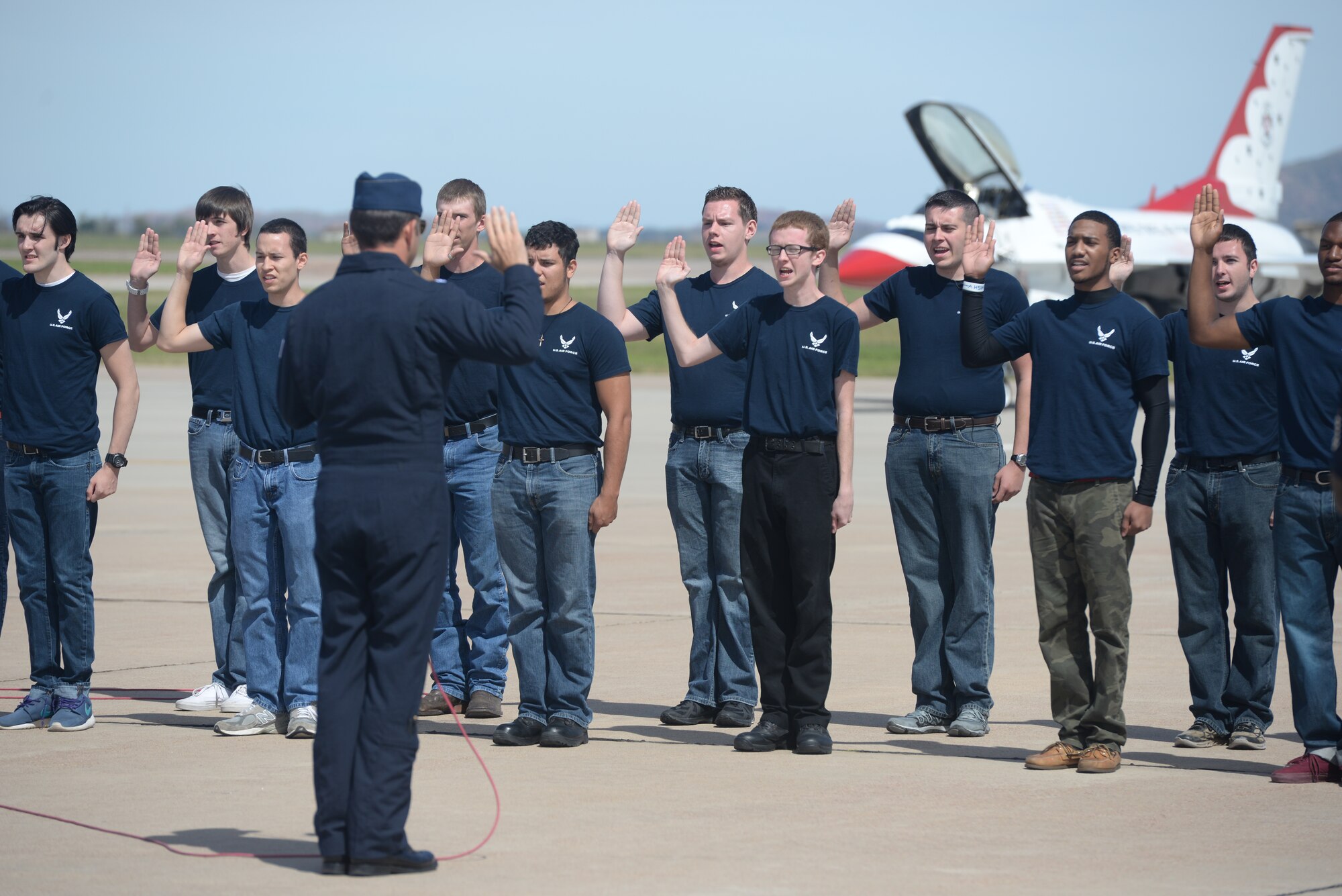 ALTUS AIR FORCE BASE, Okla. – Thomas Farley repeats the Oath of Enlistment during the 2014 Wings of Freedom Open House, Sept. 13, 2014. Thomas and more than 20 other high school graduates began their career in the Air Force by being sworn in by the U.S. Air Force Thunderbirds. (U.S. Air Force photo by Senior Airman Levin Boland/Released)