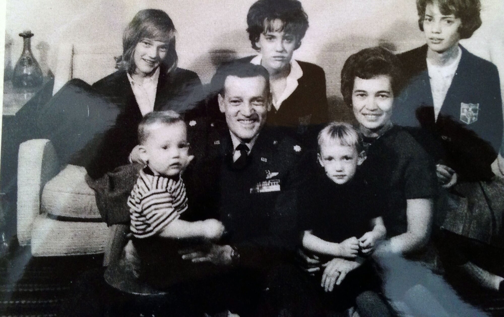 Maureen Kozak, the wife of Col. Raymond A. Kozak, 512th Airlift Wing commander at Dover Air Force Base, Del., sits on her mother’s lap for a family photo taken in 1963 in the United Kingdom. Her brother Brian sits on the lap of their father Maj. Kelly Cook, who was declared missing in action four years after this photo was taken. Mrs. Joanne Cook was expecting their sixth child in this photo. (Submitted photo)  