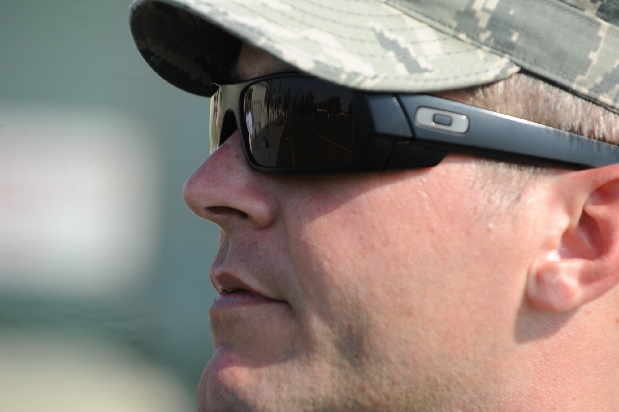Master Sgt. Jeremy Phillips, 8th Civil Engineer Squadron explosive ordnance disposal superintendent and the Wolf Pack's Combined Federal Campaign-Overseas project officer, watches a game of ultimate frisbee during the CFC-O kickoff events at Kunsan Air Base, Republic of Korea, Sept. 13, 2014.  Wolf Pack Airmen were granted the opportunity to donate to their charity of choice or make an undesignated donation while participating in a frisbee and bowling tournament throughout the day. (U.S. Air Force photo by Senior Airmen Divine Cox)