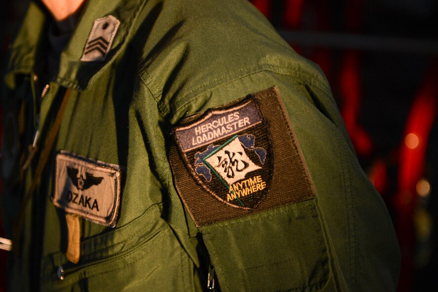 A Japan Air Self-Defense Force loadmaster wears a patch representing his unit at Yokota Air Base, Japan, Sept. 11, 2014. Members with the 36th Airlift Squadron showcased their night vision goggle capabilities to a group of JASDF members during routine NVG flights. (U.S. Air Force photo by Staff Sgt. Cody H. Ramirez/Released)