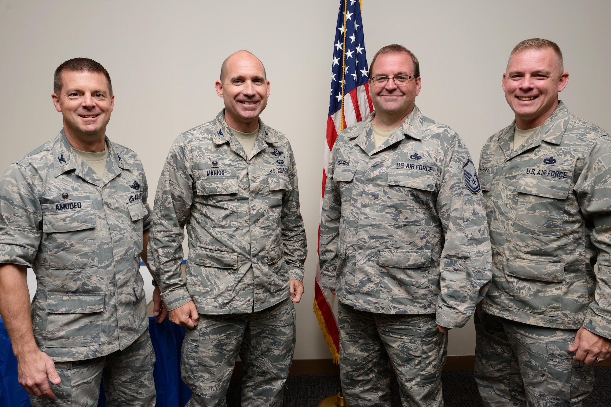 Master Sgt. John Dufrene (second from right), 403rd Maintenance Group noncommissioned office-in-charge of maintenance operations control, poses with 403rd Wing commander Col. Frank Amodeo, 403rd Wing vice commander Col. Michael Manion, and 403rd Wing Command Chief Master Sgt. Christopher Barnby at a ceremony honoring him for receiving the 2014 Air Force Reserve Command General Lew Allen Jr. Award. The award is given annually to honor a base-level officer and a senior NCO working in aircraft, munitions or missile maintenance directly involved in sortie generation. (U.S. Air Force photo/Tech. Sgt. Ryan Labadens)