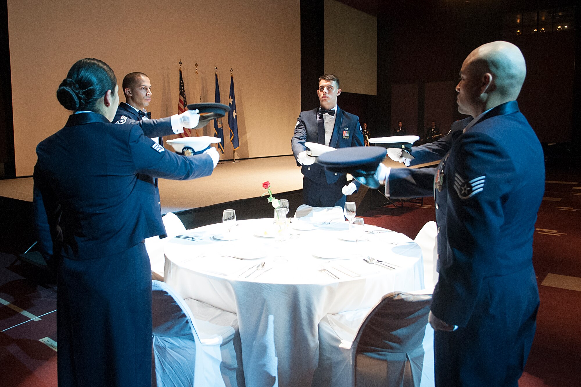 The Osan Air Base Honor Guard performs the Prisoner of War and Missing in Action tribute ceremony during the 67th Air Force Ball in Seoul, Republic of Korea, Sept. 13, 2014. This ceremony is a tribute to all POWs or MIA and also as a remembrance to keep them in our thoughts. (U.S. Air Force photo by Senior Airman Matthew Lancaster)