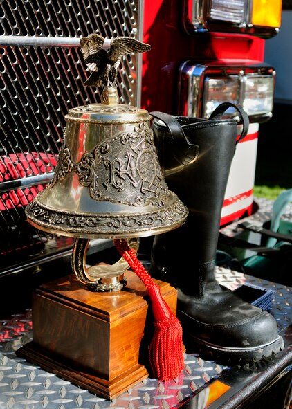A bell stands ready to be tolled by Eglin Air Force Base firefighters at the end of the annual 9/11 memorial tower climb, Sept. 11.  Firefighters carried the tags of each of the 343 firefighters killed on 9/11 to the top of the air traffic control tower to be placed on a memorial display.  Once at the top the name was read aloud.  The event ended with participants hanging the display over the balcony of the tower with an American Flag. (Courtesy photo)