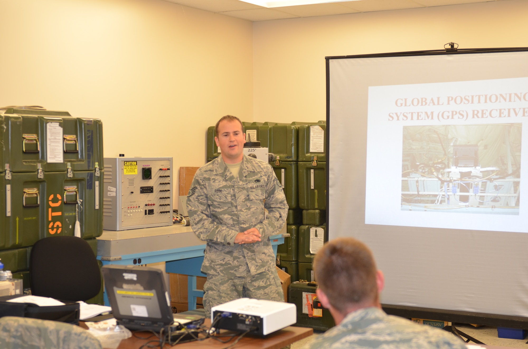 U.S. Air Force Staff Sgt. Todd Ridge teaches Communication Navigation (COMNAV) systems theory to former Electronic Warfare Counter Measures (ECM) Airmen at Rosecrans Air National Guard Base, Mo., Sept. 10, 2014.  The ECM and COMNAV career fields officially merged into one career field, Integrated Communication Counter Measures Navigation Systems, Aug. 1, 2014. (U.S. Air National Guard photo by Tech. Sgt. Theo Ramsey/Released)

