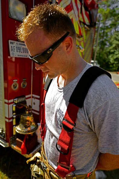 An Eglin Air Force Base firefighter observes a moment of silence aftert the department’s annual 9/11 memorial tower climb, Sept. 11.  Firefighters carried identification tags of each of the 343 firefighters killed on 9/11 to the top of the air traffic control tower to be placed on a memorial display.  Once at the top the name was read aloud.  The event ended with participants hanging the display over the balcony of the tower with an American Flag. (U.S. Air Force photo/Tech. Sgt. Cheryl L. Foster)