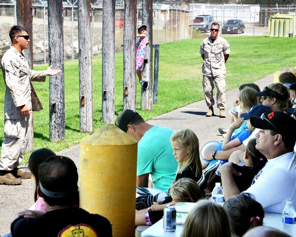 Sgt. Chadmichael Herman, an Assault Amphibious Vehicle crew chief, presented a briefing on Marine Corps leadership traits and core values to the daughters and dads attending the YMCA Adventure Princess Program Sept. 6 at Camp Pendleton, California. During the event, AVTB provided demonstrations, displays and tours for 37 fathers and 48 daughters from the local community.