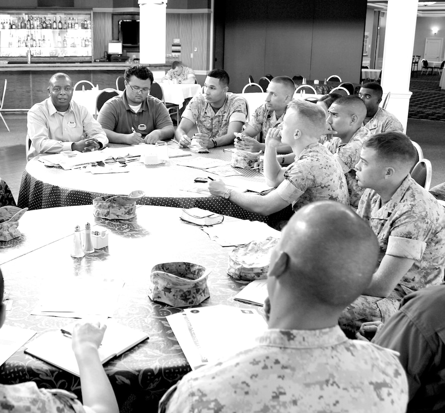 Around 20 Single Marine Program representatives gathered with Micheal Moore, SMP director, and Sgt. Maj. Mark Byrd, sergeant major of Marine Corps Base Quantico, for a SMP council meeting at The Clubs at Quantico on Sept. 4. The group discussed upcoming events, volunteer opportunities and quality of life issues during the meeting. 
