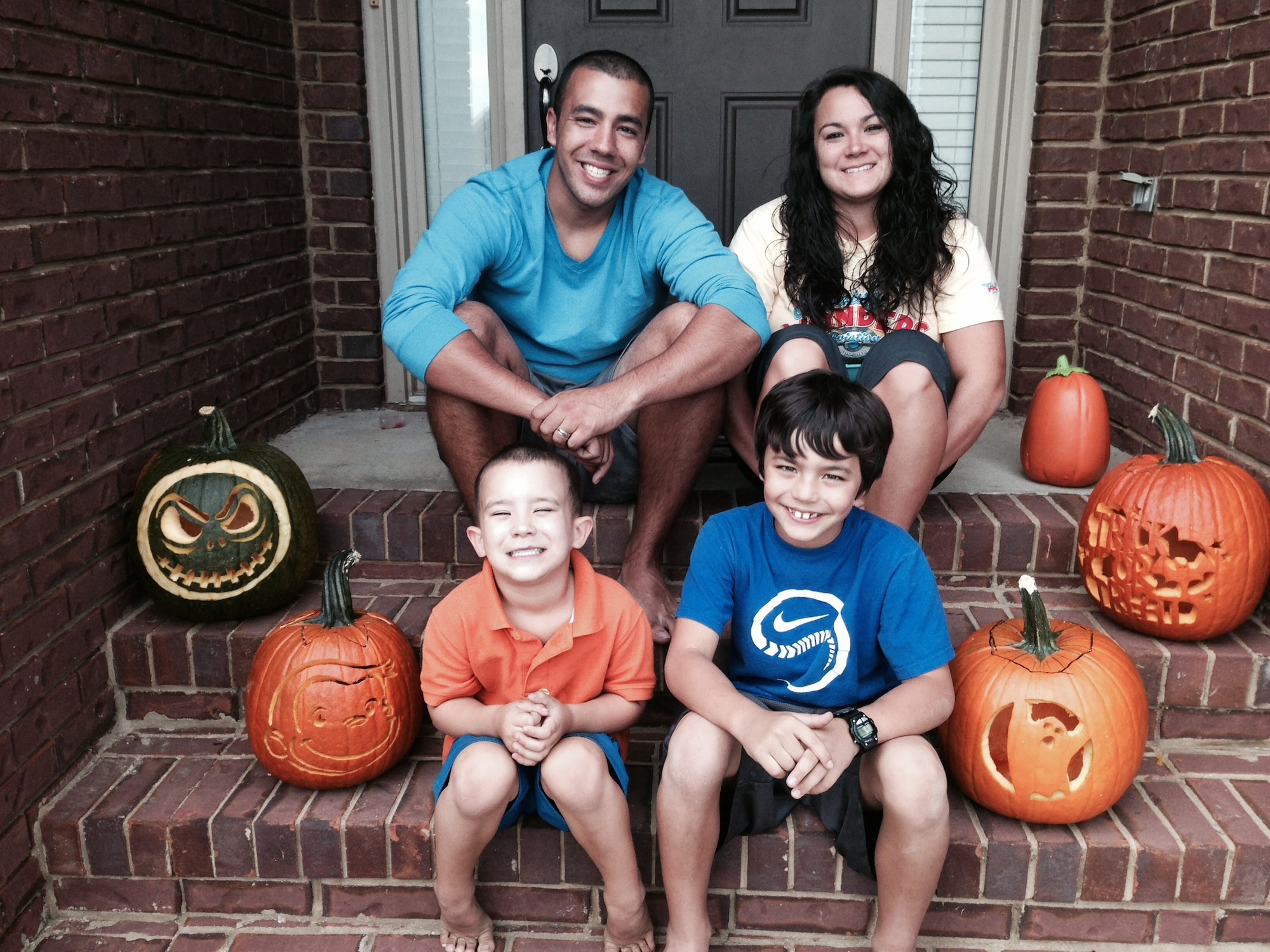 Staff Sgt. Rey Edenfield poses with his wife, Amy, and their two sons, Grayson,left, and Dawson on the front porch of their home Oct. 27, 2013. The picture was taken the day before Edenfield was involved in a motorcycle accident that resulted in his left leg being amputated six inches below the knee. Edenfield is an air traffic controller at Maxwell Air Force Base, Ala. (Courtesy photo) 