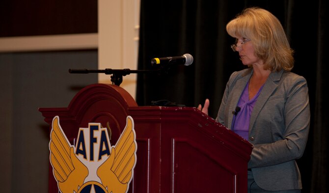 Retired Chief Master Sgt. Athena Cody, spouse of Chief Master Sgt. of the Air Force James A. Cody, speaks during the 2014 Spouse and Family Forum at the Air Force Association Air And Space Symposium Sept. 15, 2014, in Washington, D.C. Athena discussed the main points of being an Air Force Spouse touching on connecting with others, communicating through new age mediums and supporting the younger generations in their ways of communication.(U.S. Air Force photo/Staff Sgt. Carlin Leslie)