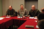 Brig. Gen. Al Dohrmann, Bismarck, N.D., addresses a question from Goran Maksimovic (seated with audio recorder), a correspondent with Radio Hit Laser in Pasjan, Kosovo, during the general's Press Coffee event in Gjilan/Gnjilane, Kosovo Jan. 26, 2010.