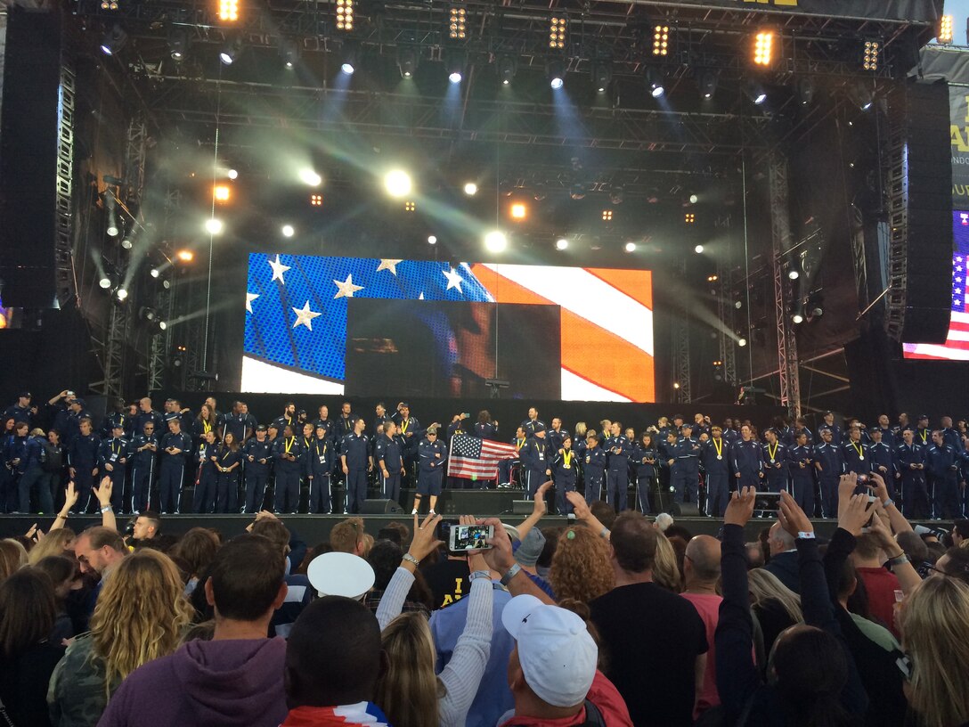USA Team members gather to be recognized on stage Sept. 14, 2014, at the closing ceremony of the Invictus Games in London. Approximately 26,000 people were on hand for the event. The games featured athletes competing in various Paralympic-style events, including swimming, track and field, seated volleyball, wheelchair basketball, and wheelchair rugby, among others. (Courtesy photo)