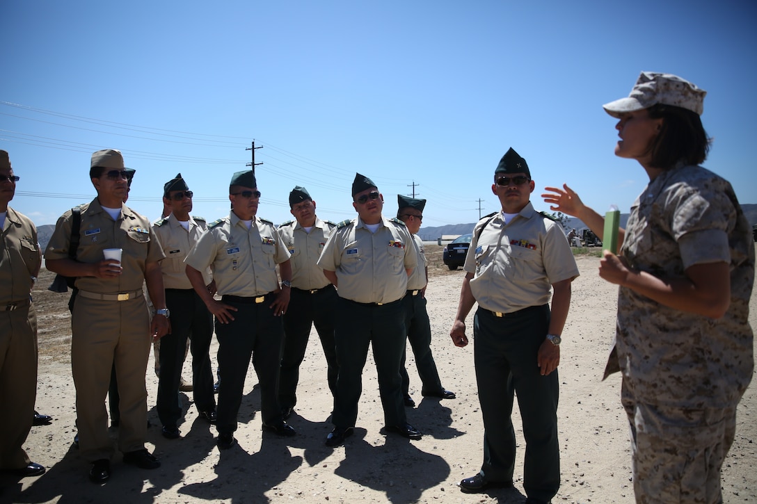 1st Lt. Stephanie Bohlen, future operations officer with Combat Logistics Battalion 13, 1st Marine Logistics Group, and a native of San Francisco, conducts a brief on the different static displays that were presented to members of the Colombian School of Advanced Warfighting as part of the Colombian Observance Exchange Program Sept. 2, 2014 aboard Camp Pendleton, Calif. More than thirty officers of the Colombian School of Advanced Warfighting visited 1st MLG to allow members of both the U.S. Marine Corps and Colombian Armed Forces to build an understanding of services, share best practices and strengthen camaraderie and interoperability. (U.S. Marine Corps photo by Sgt. Laura Gauna/released)