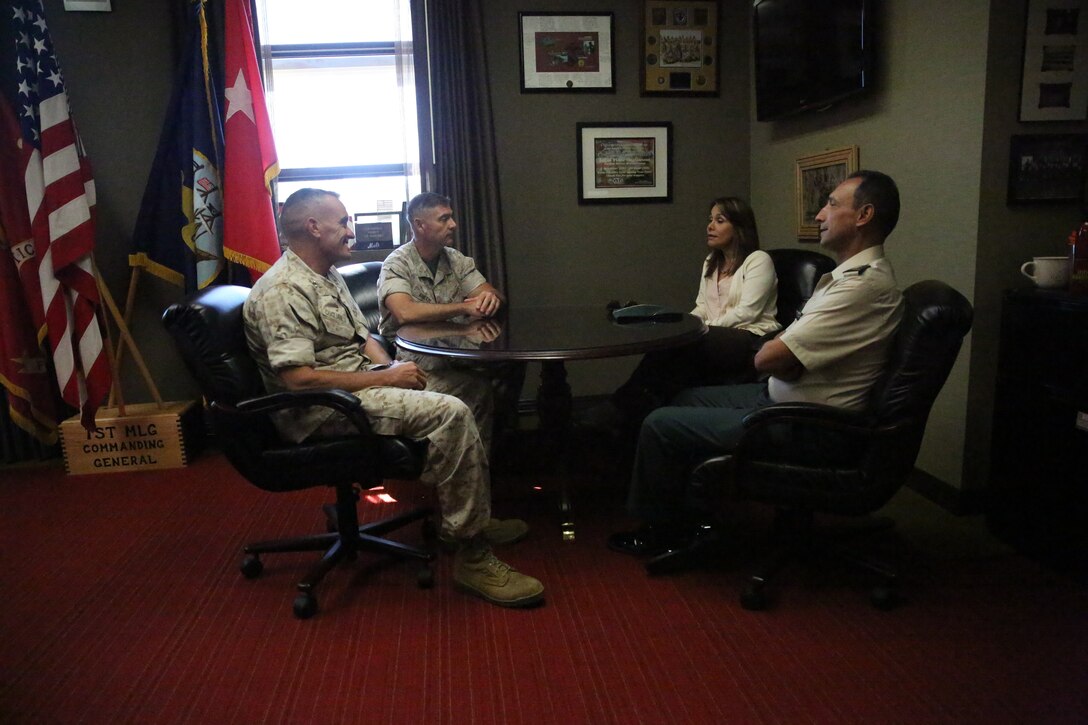 Major Gen. Vincent A. Coglianese, 1st Marine Logistics Group Commanding General, speaks with Brig. Gen. Leonardo Pinto Morales, commander of the 7th Division of the Colombian Army, and his wife, as part of the Colombian Observance Exchange Program Sept. 2, 2014 aboard Camp Pendleton, Calif. More than thirty officers of the Colombian School of Advanced Warfighting visited 1st MLG to allow members of both the U.S. Marine Corps and Colombian Armed Forces to build an understanding of services, share best practices and strengthen camaraderie and interoperability.