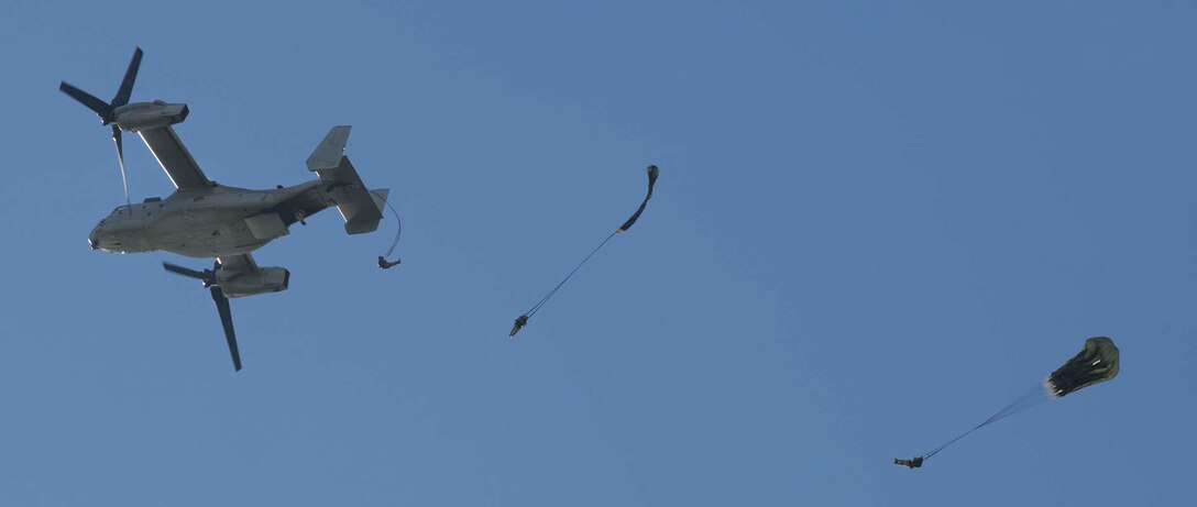 Marines execute a low-level static-line jump from an MV-22B Osprey tiltrotor aircraft Aug. 26 at Ie Shima Airfield, Okinawa, Japan. The training recertified the Marines capabilities as airborne and air delivery specialists, also known as parachute riggers. The Marines are with Combat Logistics Regiment 3, 3rd Marine Logistics Group, III Marine Expeditionary Force. (U.S. Marine Corps photo by Lance Cpl. Matt Myers/Released)