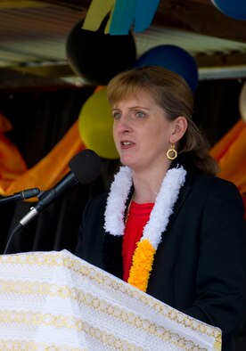 Melanie Higgins, deputy chief of missions of the U.S. Embassy in Port Moresby, Papua New Guinea, addresses the crowd during the closing ceremony for Pacific Unity 14-8.PACUNITY helps cultivate common bonds and fosters goodwill between the U.S. and regional nations through multi-lateral humanitarian assistance and civil military operations.  (U.S. Air Force photo by Tech. Sgt. Terri Paden/Released)                               