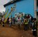 Students at Togoba Secondary School paint murals on the school walls in preparation for the Pacific Unity 14-8 closing ceremony in Mount Hagen, Papua New Guinea. PACUNITY helps cultivate common bonds and fosters goodwill between the U.S. and regional nations through multi-lateral humanitarian assistance and civil military operations.  (U.S. Air Force photo by Tech. Sgt. Terri Paden/Released)                               