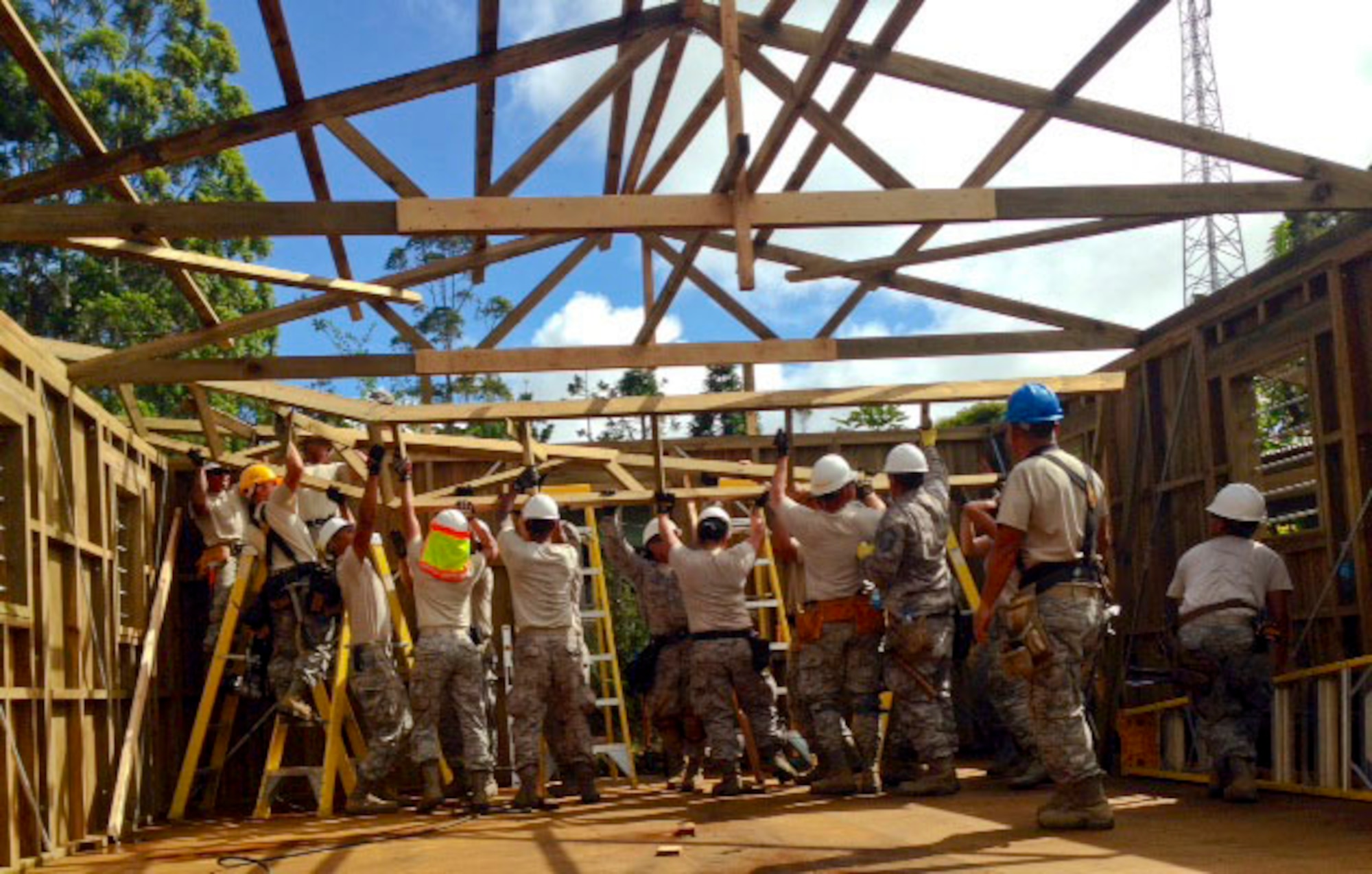 Members of the Hawaii Air National Guard 154th Civil Engineer Squadron have been working on the construction of two new dormitories to be used for female students at Togoba Secondary School in Mount Hagen, Papua New Guinea, as part of Pacific Unity 14-8. PACUNITY helps cultivate common bonds and fosters goodwill between the U.S. and regional nations through multi-lateral humanitarian assistance and civil military operations.  (U.S. Air Force photo by Airman 1st Class Jaimie Aquino/Released)                               