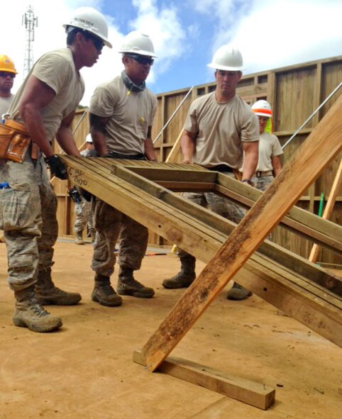 Members of the Hawaii Air National Guard 154th Civil Engineer Squadron have been working on the construction of two new dormitories to be used for female students at Togoba Secondary School in Mount Hagen, Papua New Guinea, as part of Pacific Unity 14-8. PACUNITY helps cultivate common bonds and fosters goodwill between the U.S. and regional nations through multi-lateral humanitarian assistance and civil military operations.  (U.S. Air Force photo by Airman 1st Class Jaimie Aquino/Released)                               