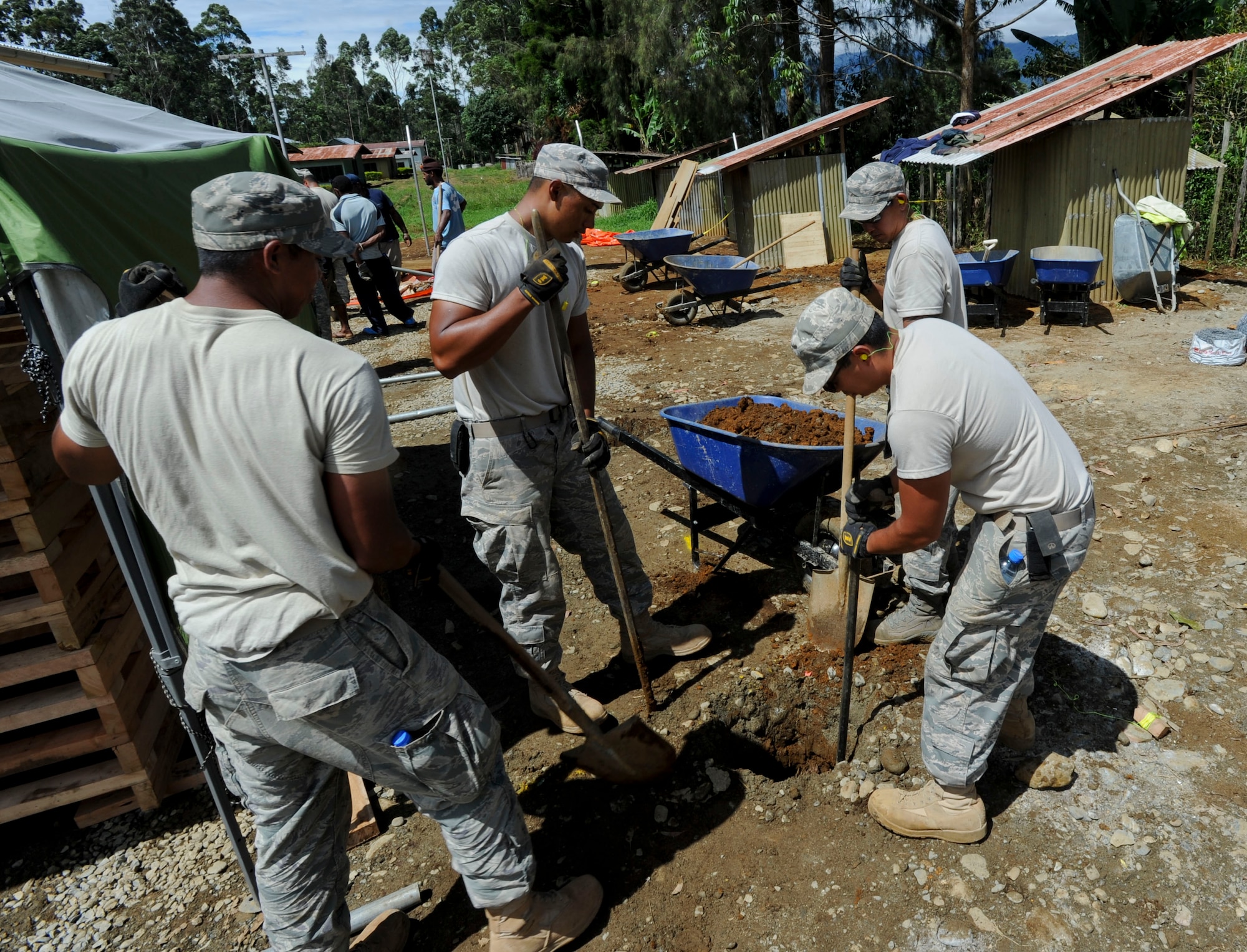 Members of the Hawaii Air National Guard 154th Civil Engineer Squadron have been working on the construction of two new dormitories to be used for female students at Togoba Secondary School in Mount Hagen, Papua New Guinea, as part of Pacific Unity 14-8. PACUNITY helps cultivate common bonds and fosters goodwill between the U.S. and regional nations through multi-lateral humanitarian assistance and civil military operations.  (U.S. Air Force photo by Tech. Sgt. Terri Paden/Released)                               
