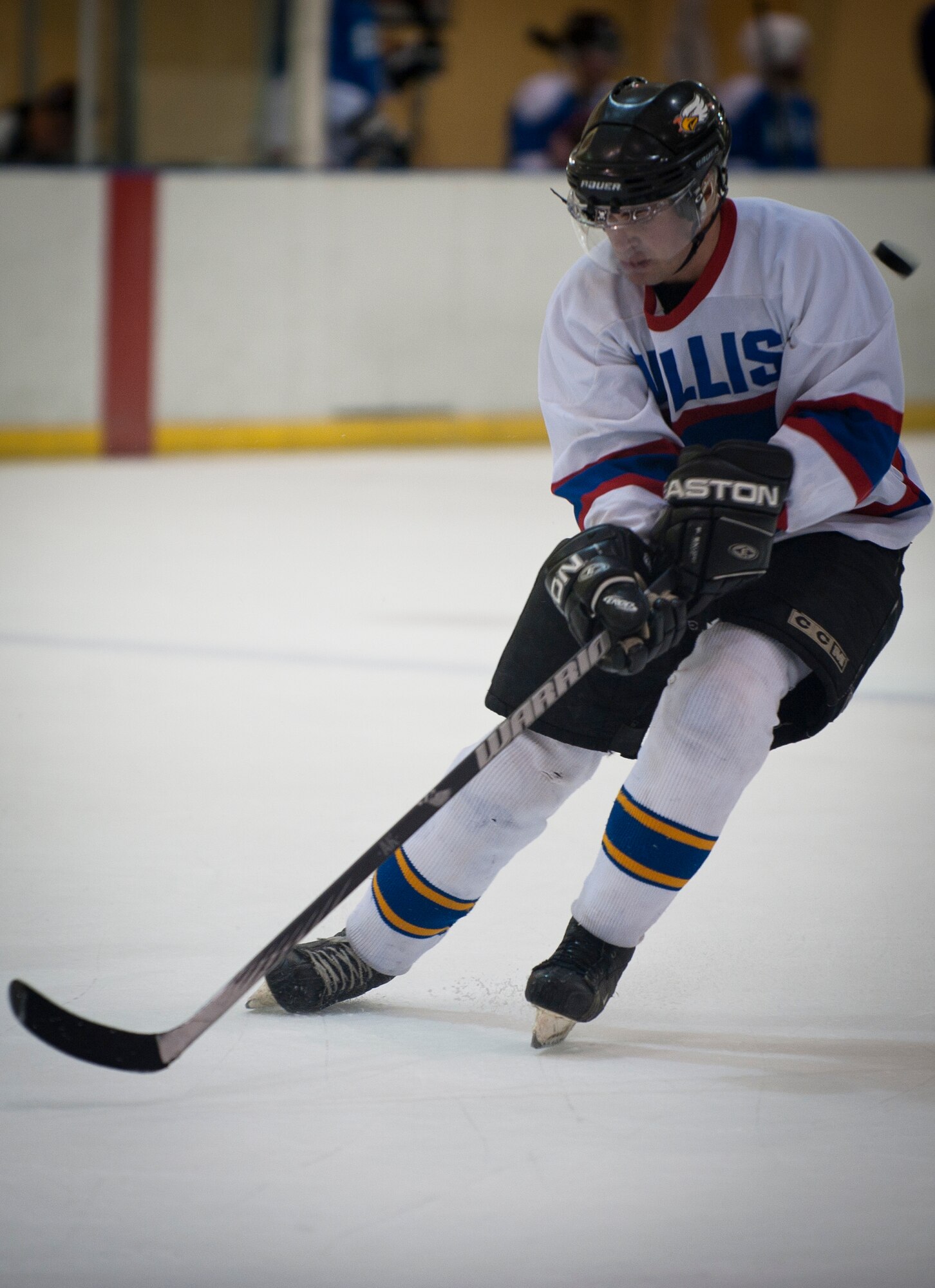 Staff Sgt. Christoper Dominick, a forward on the Nellis Air Force Base hockey team, tries to gain control of the puck during Nellis’ season-opening game against the Desert Foxes hockey team in Las Vegas Sept. 10, 2014. Dominick scored a pair of goals in regulation and one in the overtime shootout of Nellis’ 7-6 victory over the Desert Foxes. Dominick is an electrical systems craftsman assigned to the 99th Civil Engineer Squadron. (U.S. Air Force photo by Staff Sgt. Siuta B. Ika)