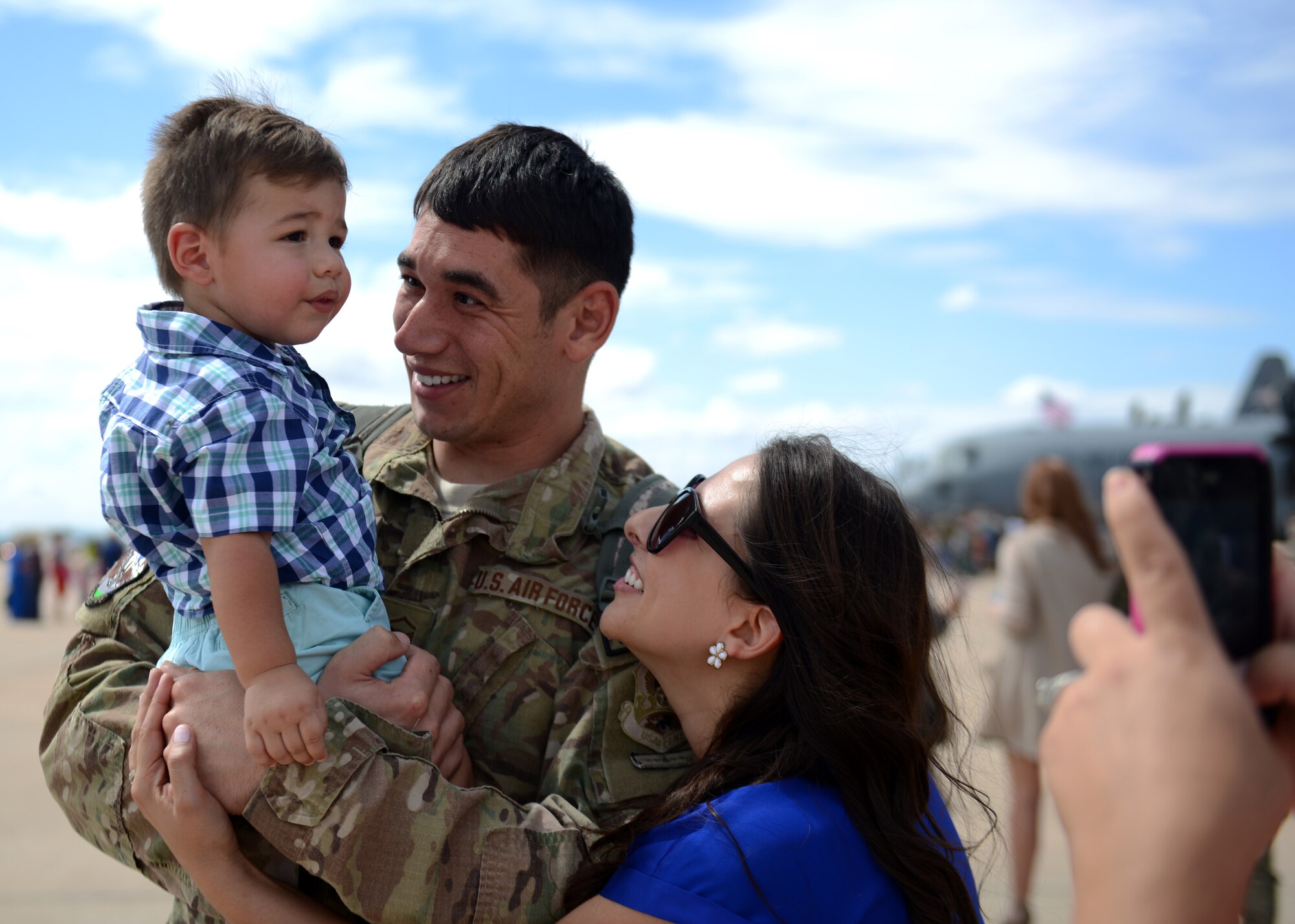 U.S. Air Force Master Sgt. Corey Boyer, 317th Aircraft Maintenance Squadron aerospace maintenance craftsman, is greeted by his wife, Blythe, and son, William, Sept. 15, 2014, at Dyess Air Force Base, Texas. While deployed, the 774th Expeditionary Airlift Squadron flew over 4,500 combat sorties and 927 combat missions, and performed more than 4,000 combat flight hours. (U.S. Air Force photo by Airman 1st Class Kedesha Pennant/Released)