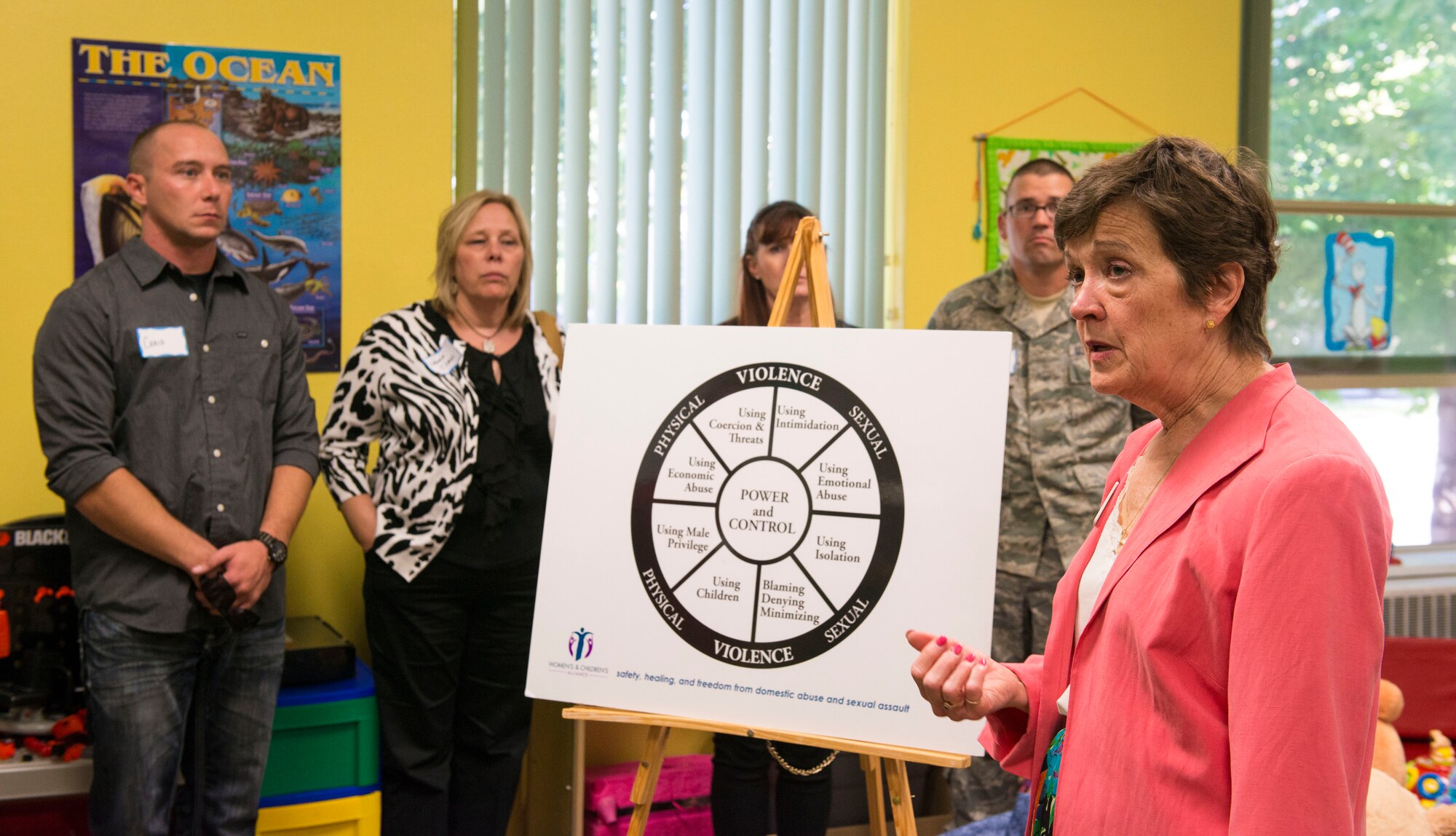 ¬¬Susan Kelley, development director at Women’s and Children’s Alliance talks, about signs of the cycle of abuse during a tour Sept. 11, 2014, at Boise, Idaho. Services the WCA provides are secure shelter, crises lines and counseling. (U.S. Air Force photo by Airman 1st Class Malissa Lott/RELEASED)