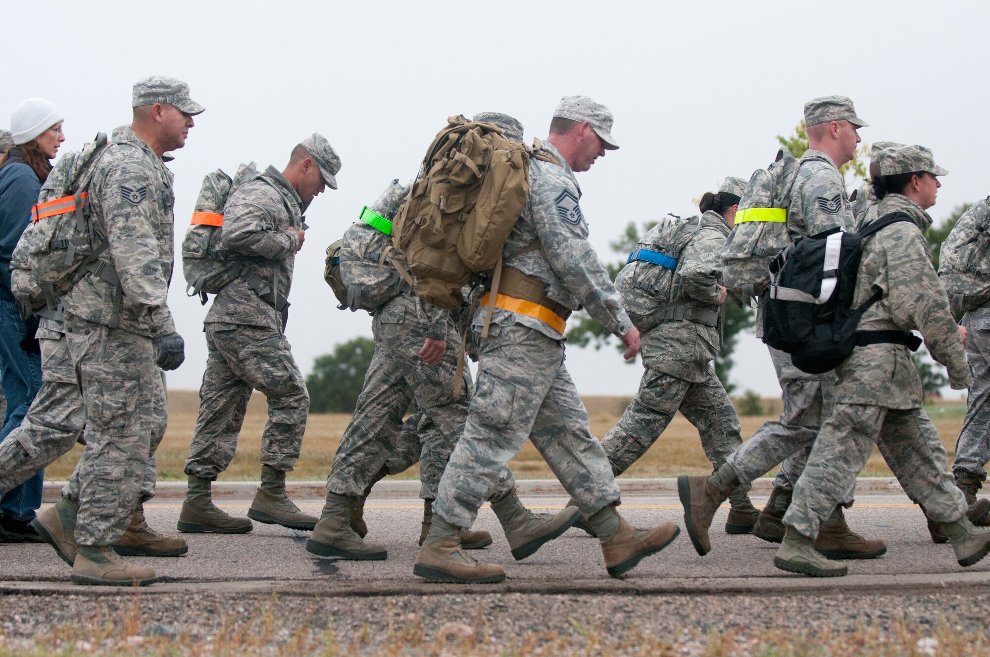 Ninetieth Logistics Readiness Squadron Airmen conduct a ruck march along the streets of F.E. Warren Air Force Base, Wyo., Sept. 11, 2014. The Airmen marched in remembrance of the Sept. 11 attacks against the U.S. and to honor F.E. Warren's first responders on the 13th anniversary of the attacks. (U.S. Air Force photo by Lan Kim)