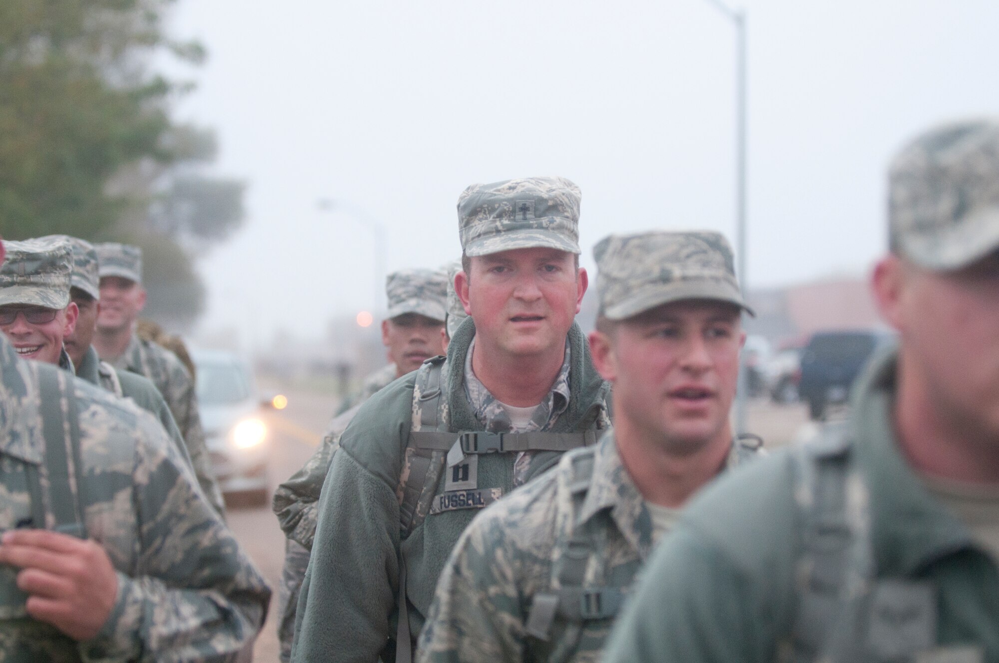 Ninetieth Logistics Readiness Squadron Airmen conduct a ruck march along the streets of F.E. Warren Air Force Base, Wyo., Sept. 11, 2014. The Airmen marched in remembrance of the Sept. 11 attacks against the U.S. and to honor F.E. Warren's first responders on the 13th anniversary of the attacks. (U.S. Air Force photo by Lan Kim)