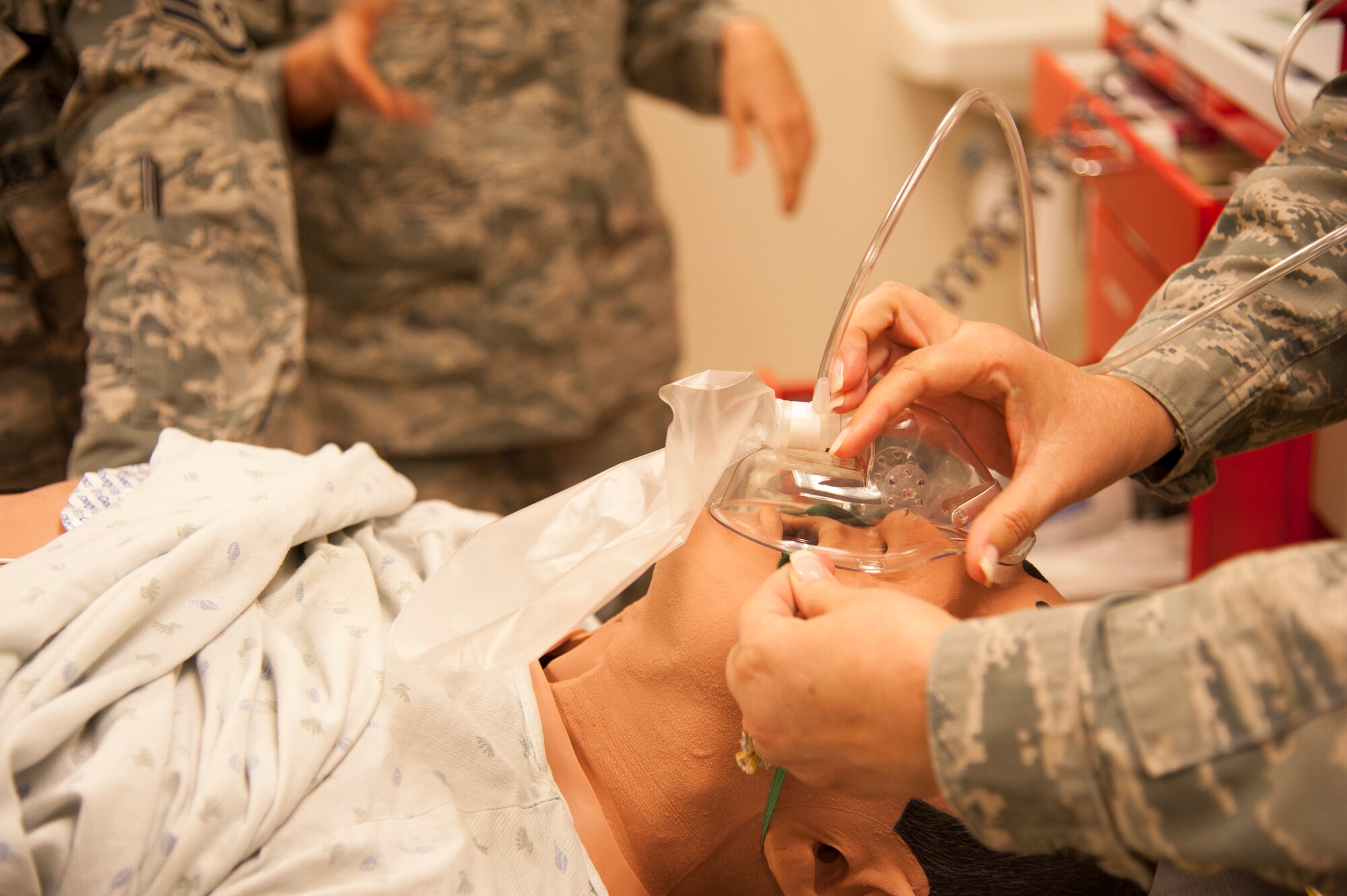 Airmen on Langley AFB, Va. train on the human patient simulator METIman. METIman can be programmed to replicate trauma and appropriately respond to treatment by students. (U.S. Air Force photo by Staff Sgt. Candice Page/Released)